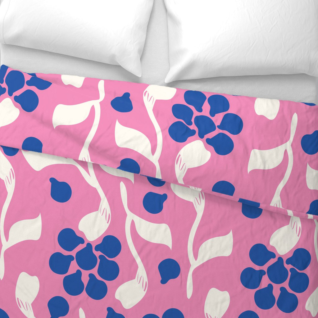A duvet cover featuring the "Summer Night in Helsinki Pink" pattern by Elli Maanpää, showing vibrant pink and white floral motifs.