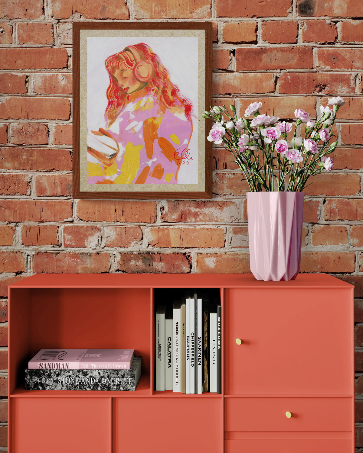 "Audiobook" art print and pink flower vase with flowers.
