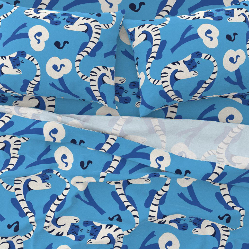 Pattern design Laughing Tiger in blue by Elli Maanpää in sheets.