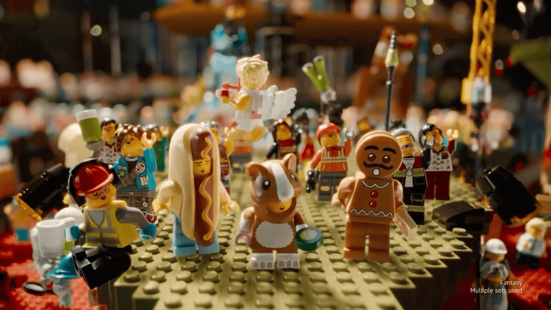 Animated LEGO holiday campaign social post asking “Is it play you’re looking for?” in a brick-filled living room.