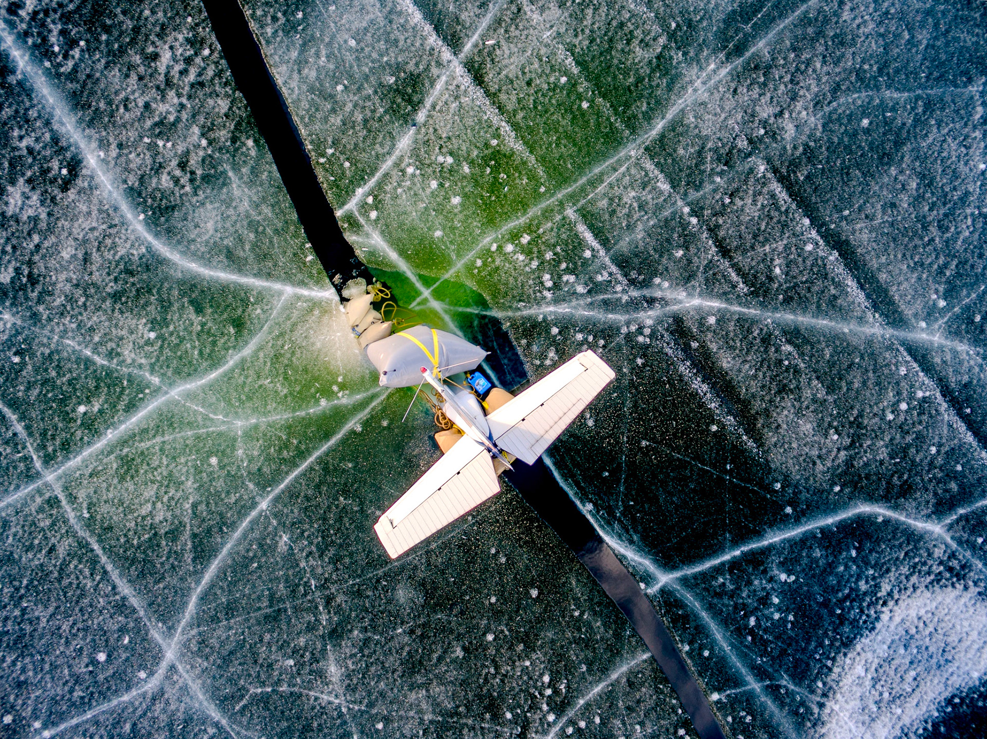 The tail of a private plane that landed on and fell through the ice on Lake Champlain. Airbags were attached to the plane to prevent it from sinking. Vermont Drone located it and also periodically flew out to and documented the plane and the fuel slick while its recovery and clean-up were being arranged.