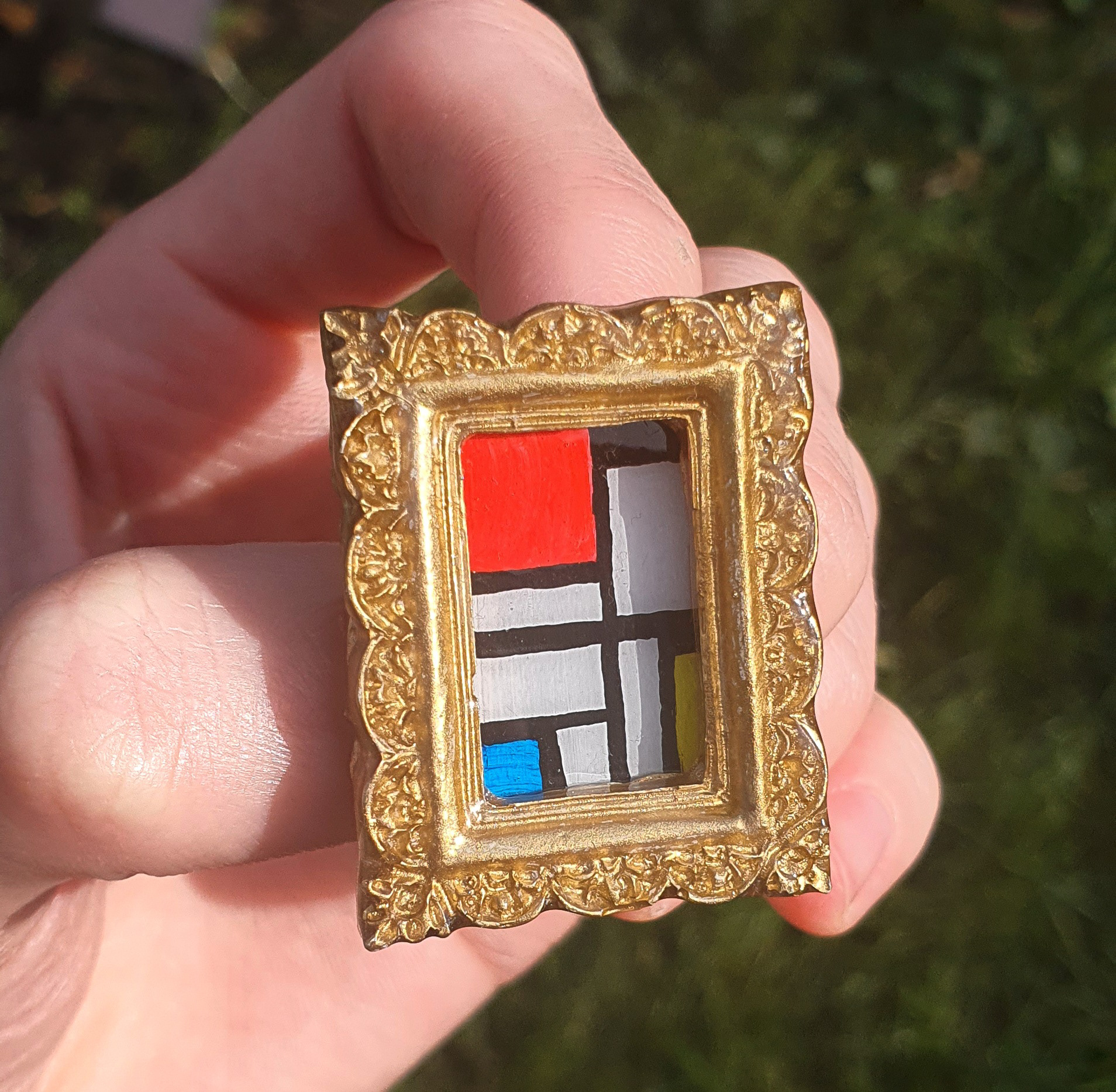 Hand painted 2cm x 1cm acrylic painting in a sculpted and resin cast frame