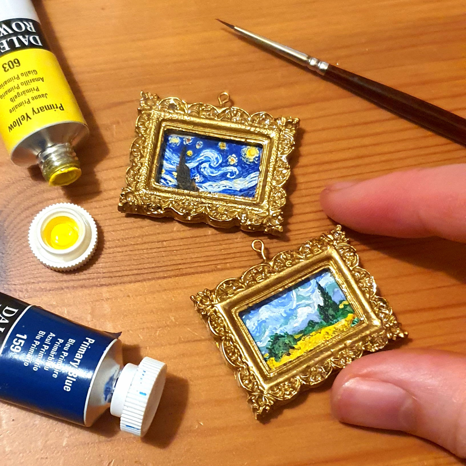 Hand painted 2cm x 1cm acrylic paintings in a sculpted and resin cast frame