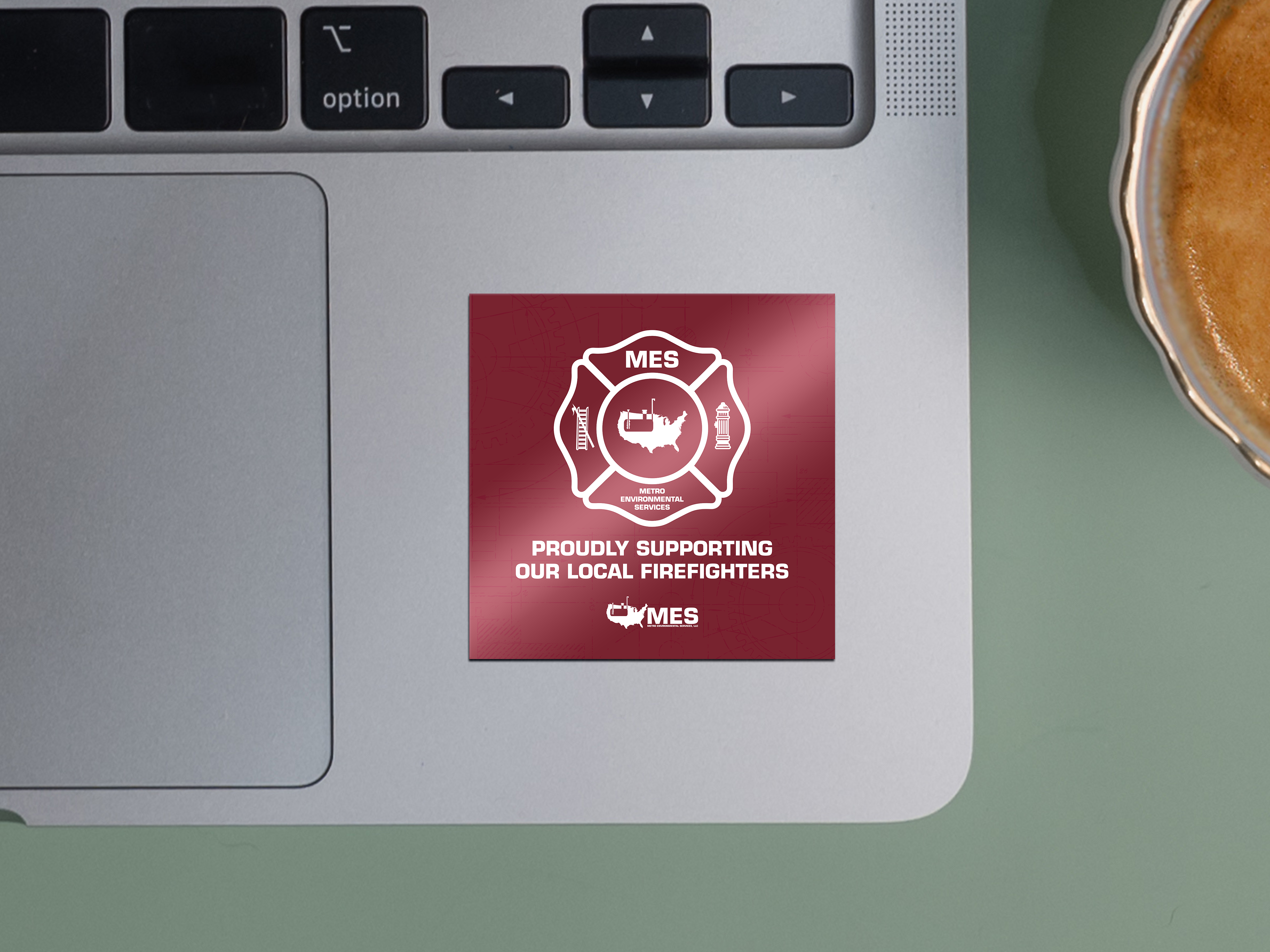 MES local firefighter support stickers on laptop.