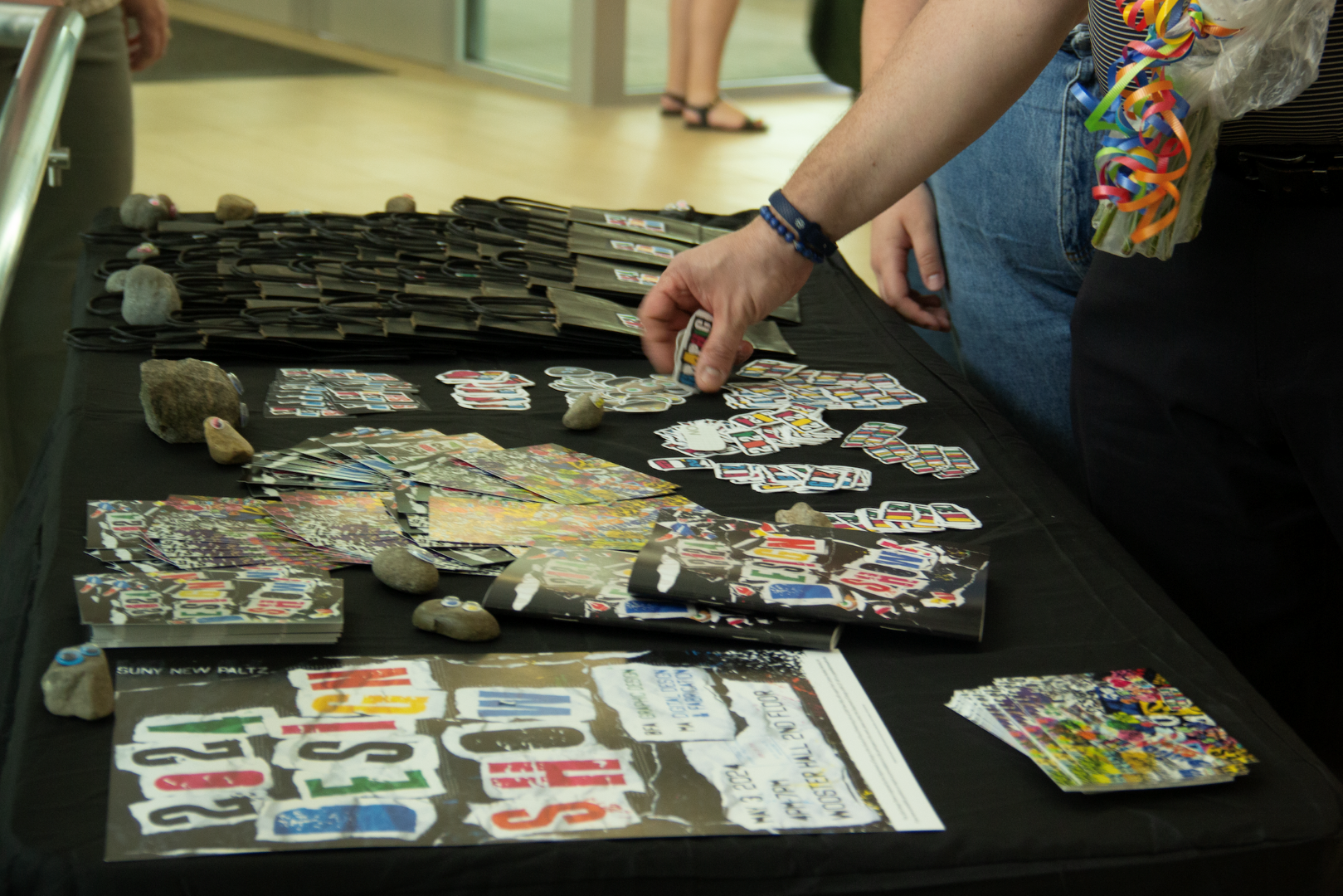 Goodie bags, a lot of stickers, 2 post card designs, pet rocks, catalogs, and the poster.