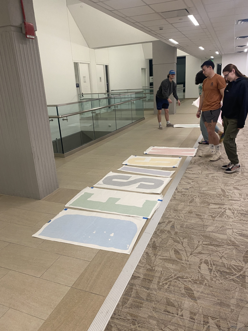Jason, Aeneas, our professor Kristoff, and I preparing to put up the letters.
