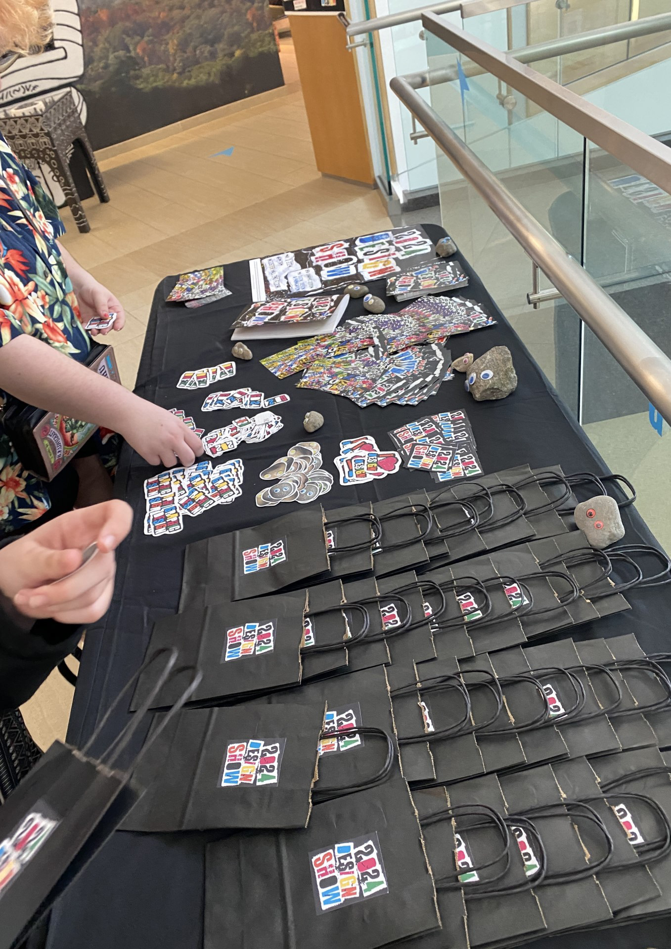 Goodie bags, a lot of stickers, 2 post card designs, pet rocks, catalogs, and the poster.