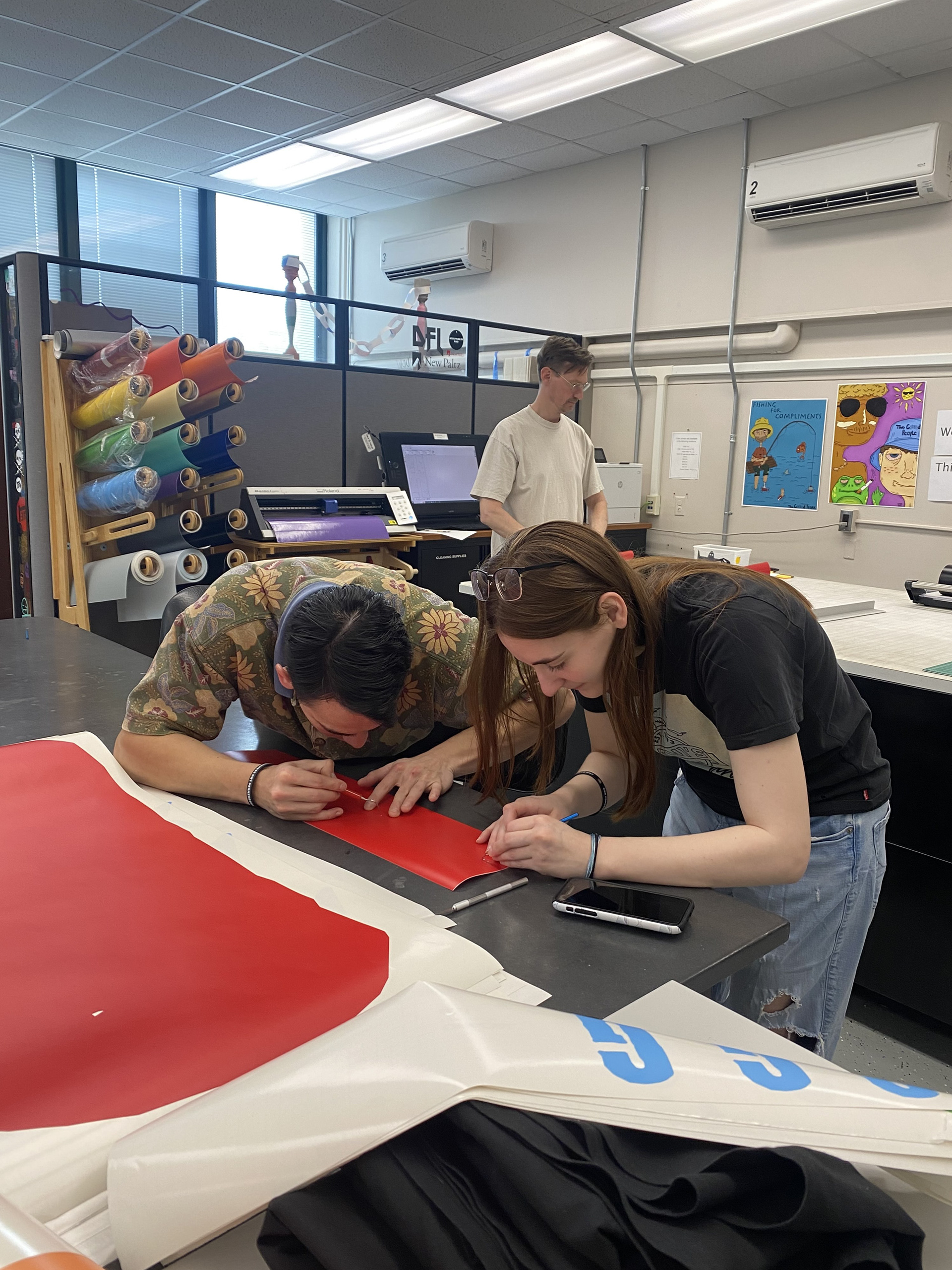 Aeneas and I peeling the smaller vinyl letters.