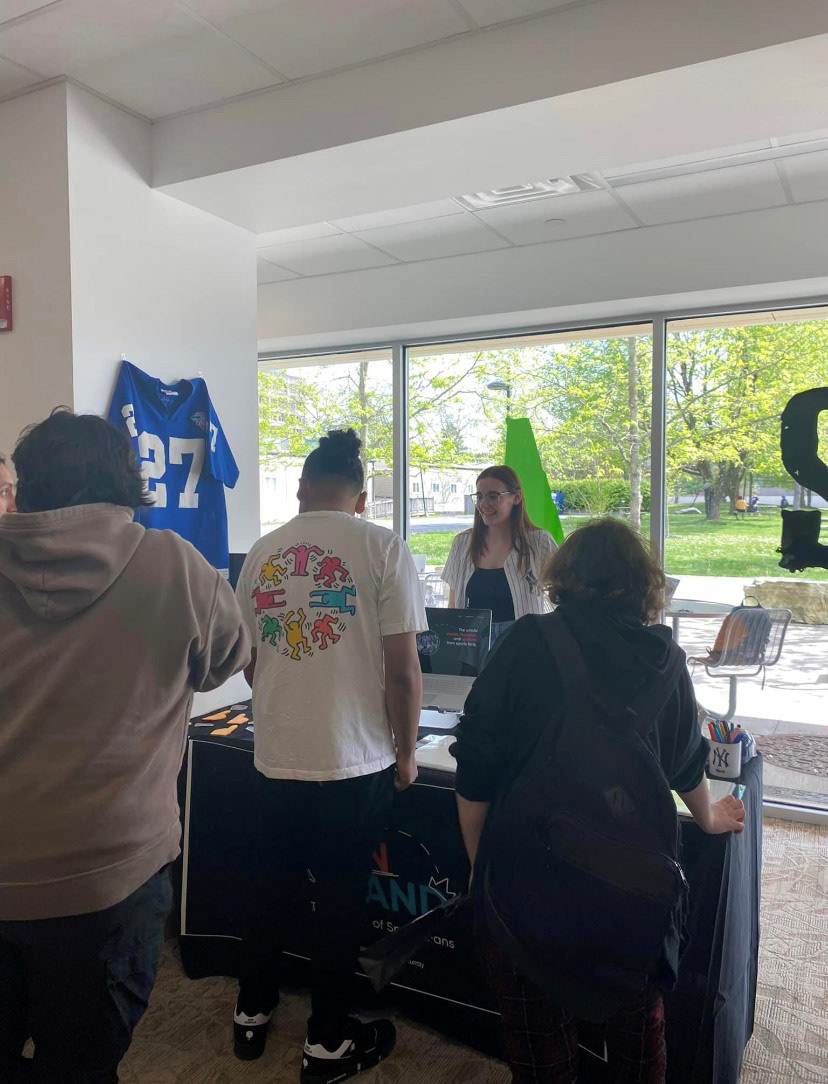 Me explaining my project to people passing by at the show.