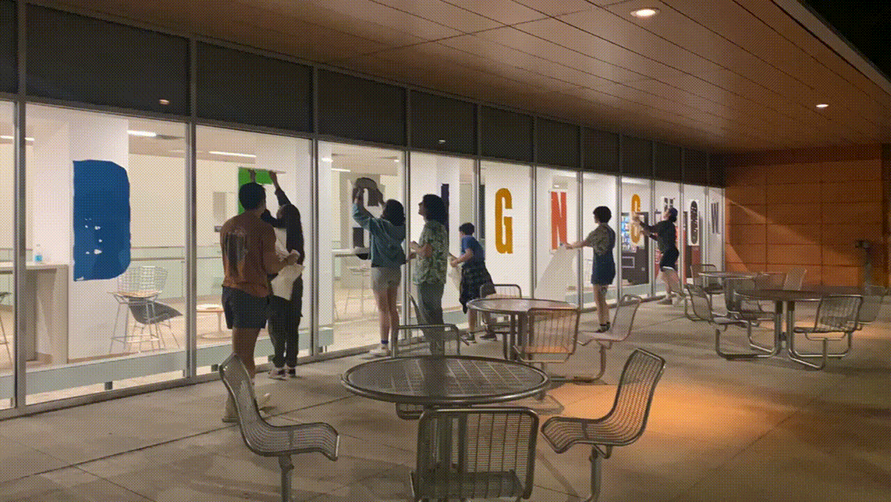 Quick time lapse of everyone putting up the big vinyl type.