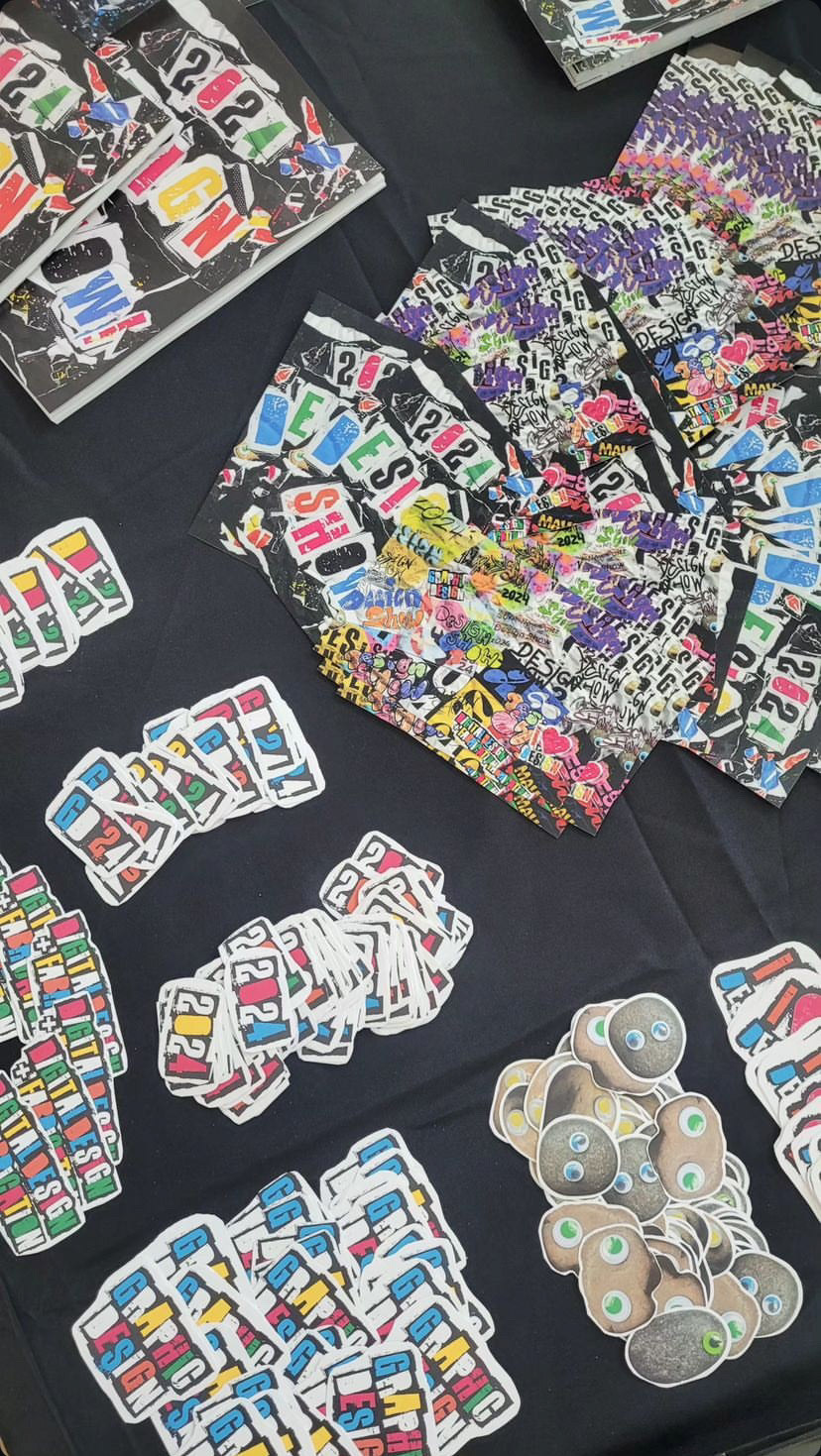 A lot of stickers, 2 post card designs, catalogs.