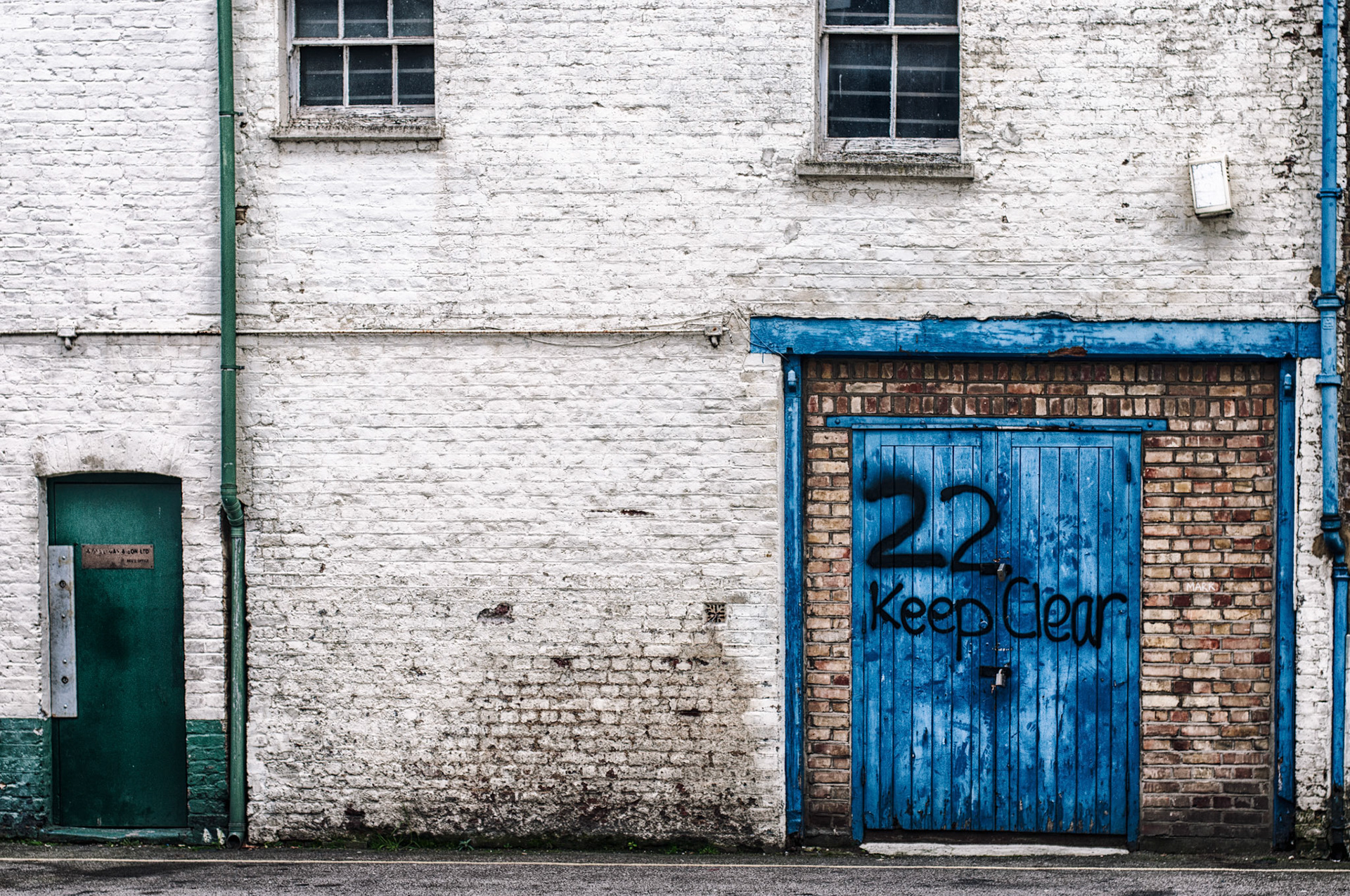 On my way from the car to a restaurant we walked down this road and commented on the need for some paint.