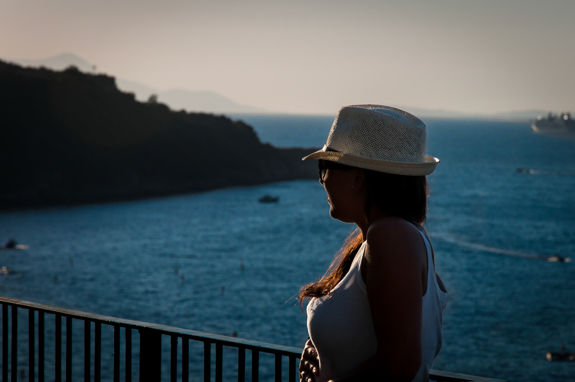 Casually watching the boats go by as they take passengers over to the isle of Capri.