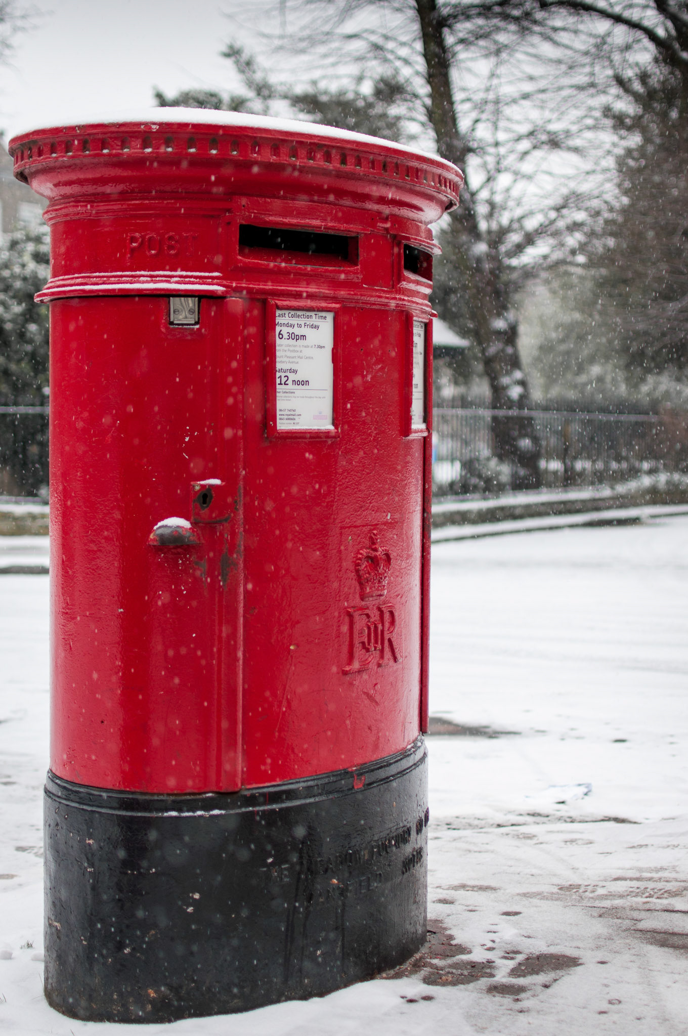 On a lonely cold street, this postbox is defiant of the cold.