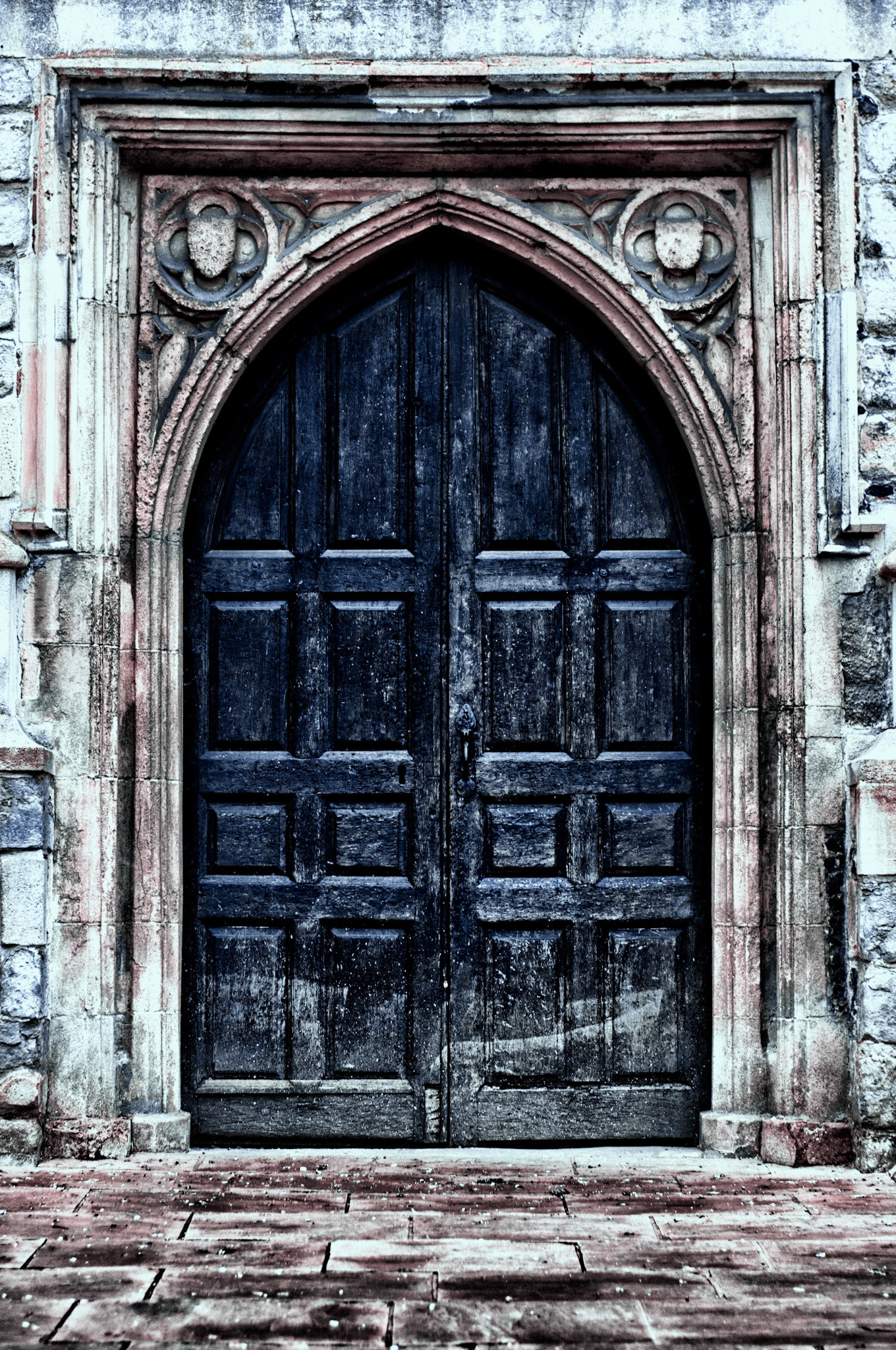 The side door of our town church looks like it's been on fire a few times.