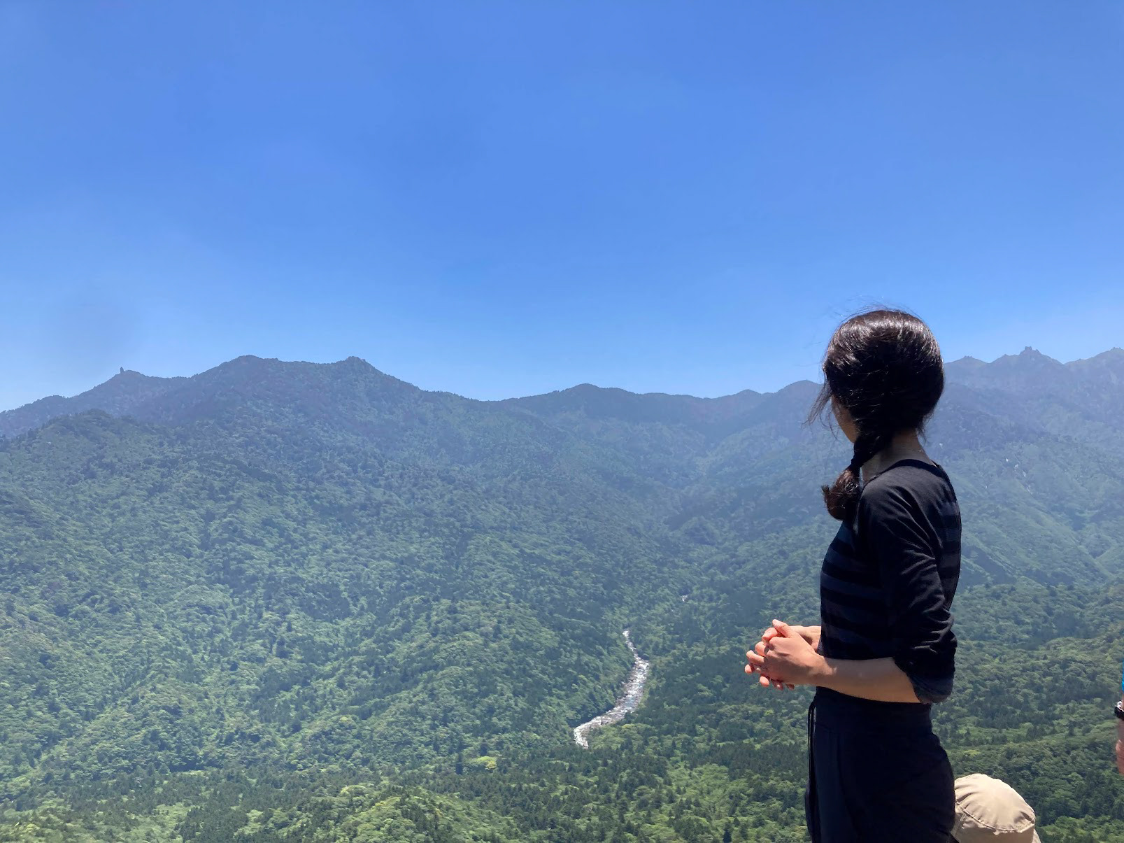 aesthetic posing in fron of the grand yakushima view from moro's rock