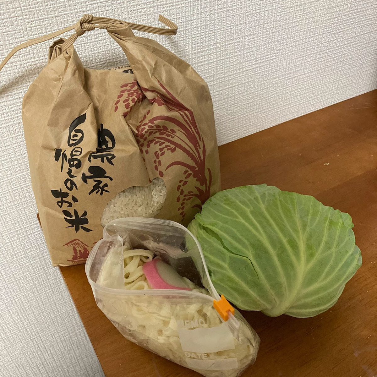 gifts they sent me home with...fresh cabbage from their garden, rice from their last harvest, and leftover fresh noods!