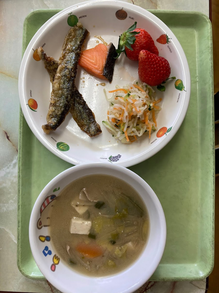 grilled mackerel, grilled salmon, pickeled daikon and carrots, strawberries, miso soup
