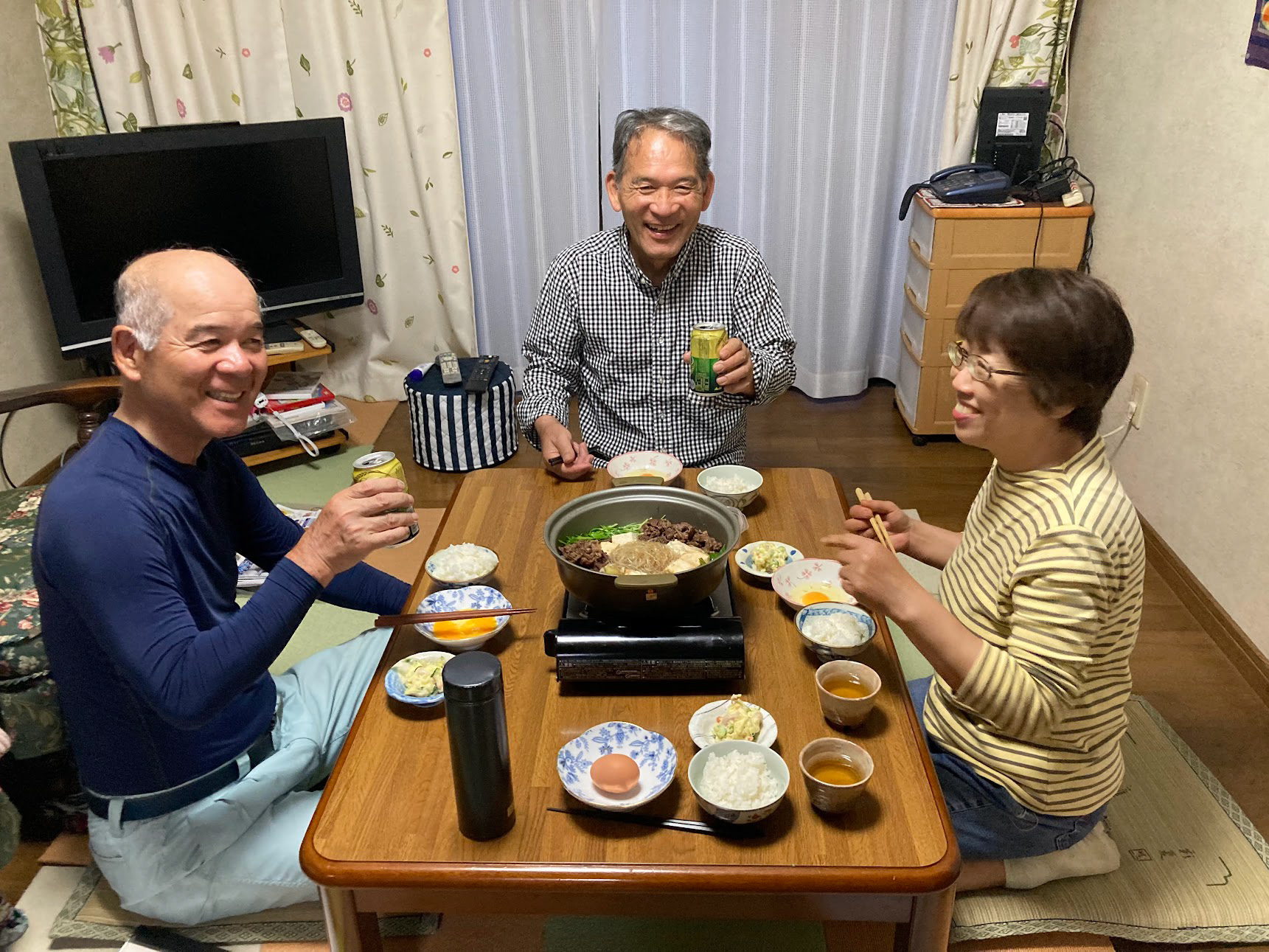 happy souls...dinner was sukiyaki with fresh rice and raw egg!