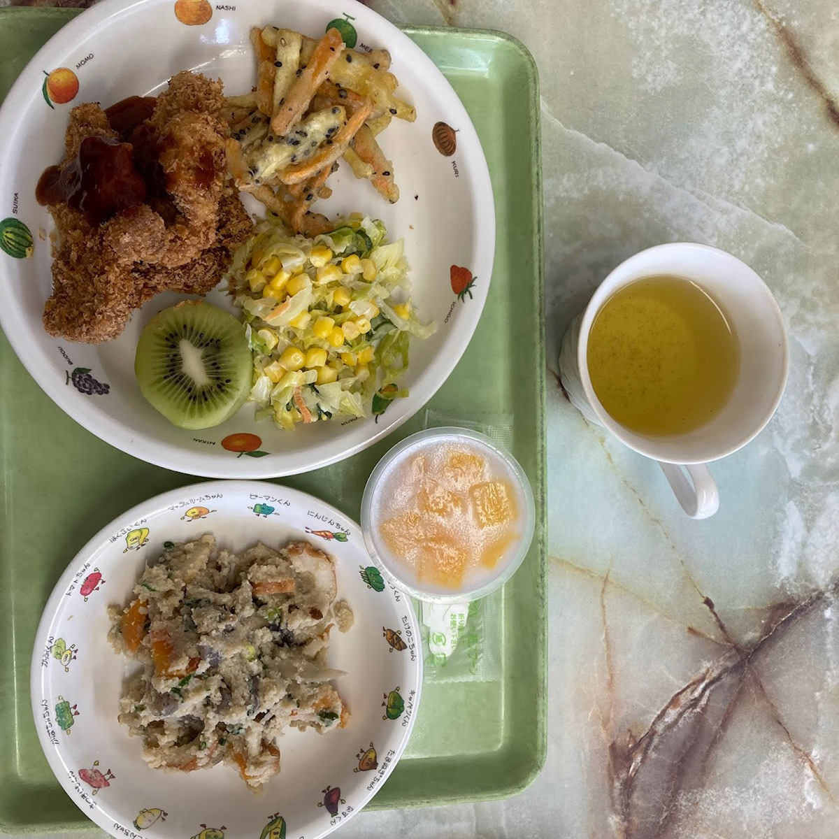 tonkatsu, sweet potato and black sesame fries, corn salad, kiwi fruit, special tofu side