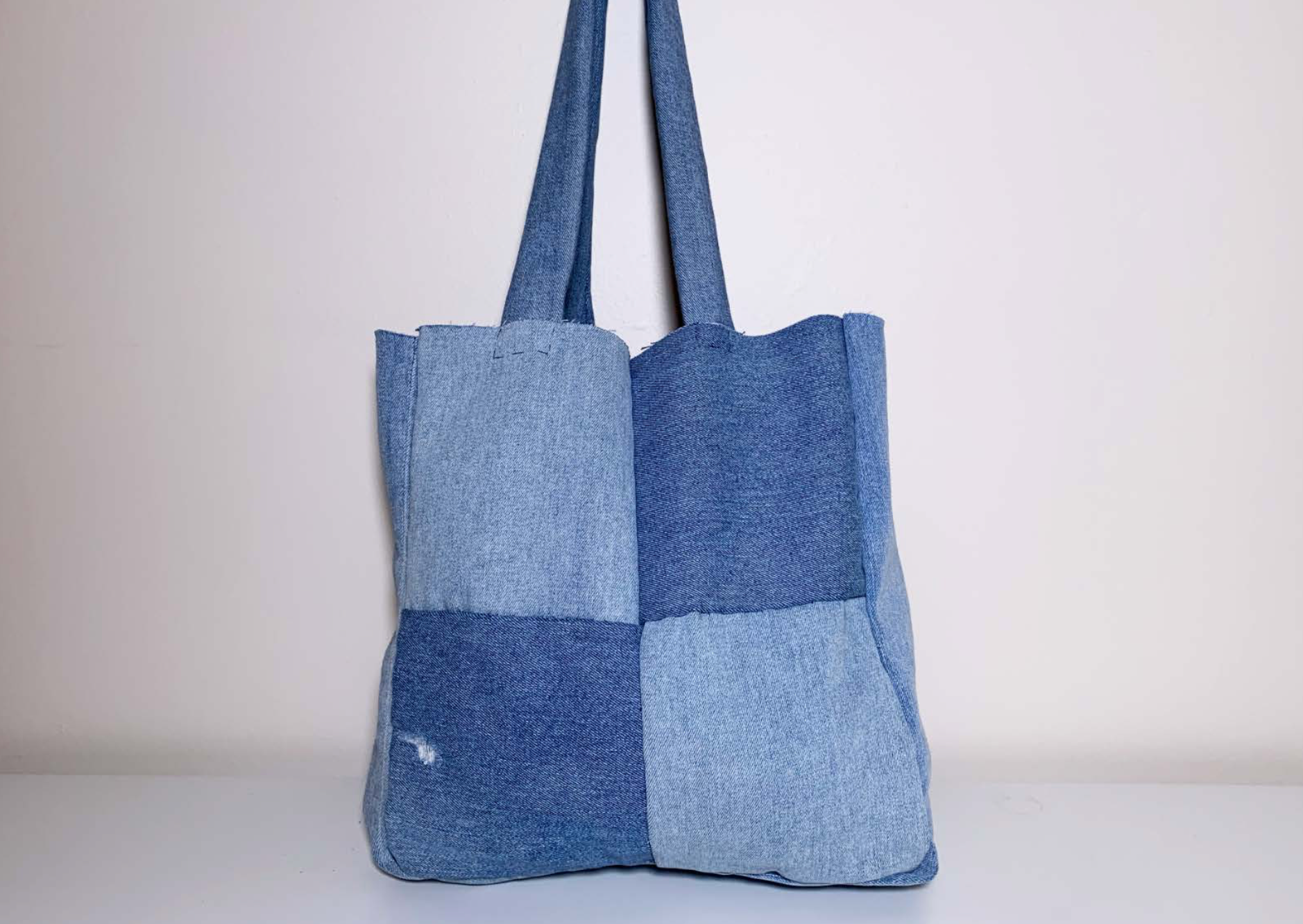 Back of hand-stitched bag