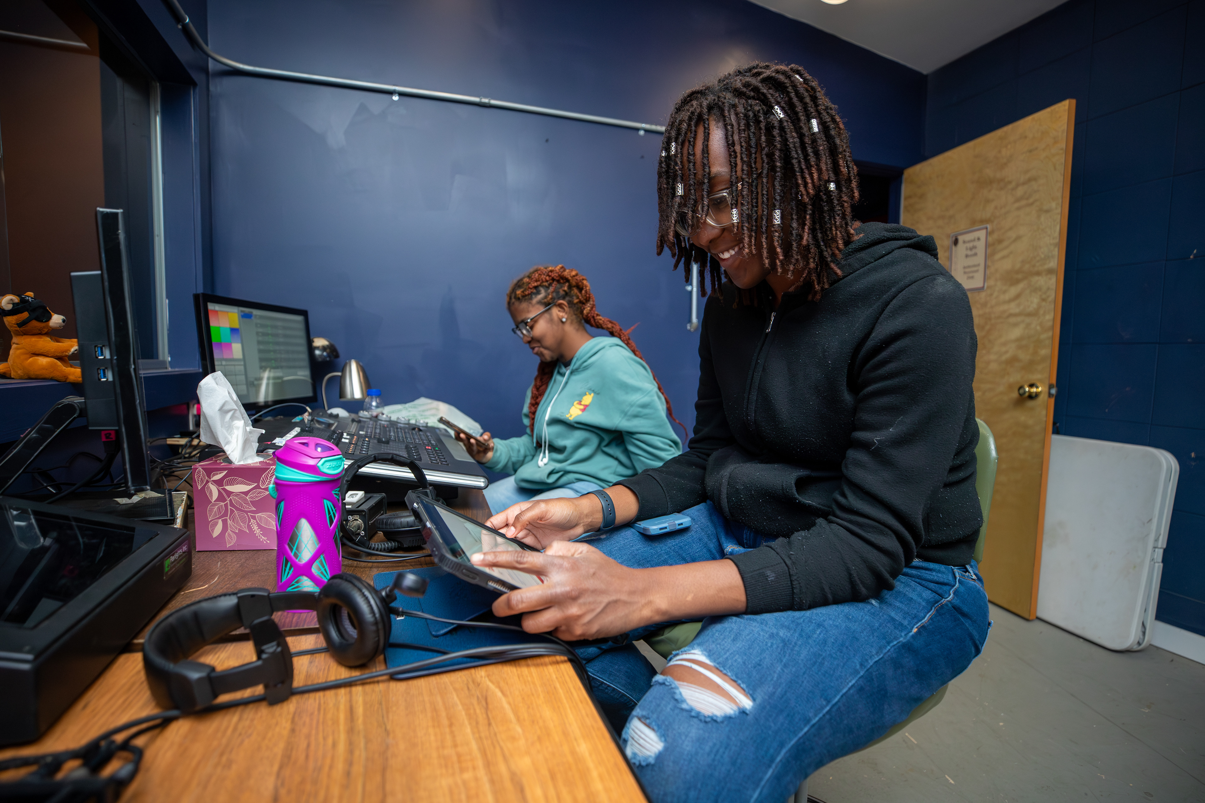 Sweet Briar College theatre students control the lights and sound for a dress rehearsal