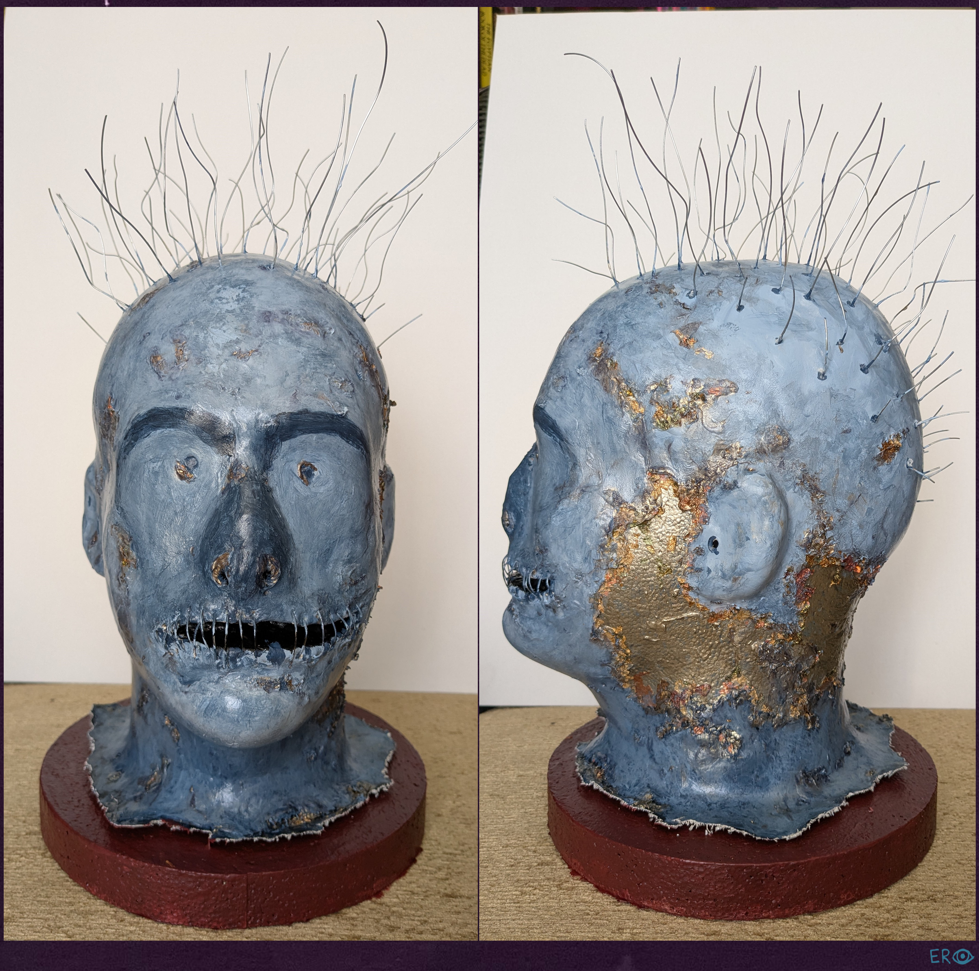 The Metal is Cold - Elias Rosenshaw 1/29/2025 - Foam head with foam clay, acrylic paint, decoupage glue, metallic flakes, gel pen, wire, canvas, and a foam base.