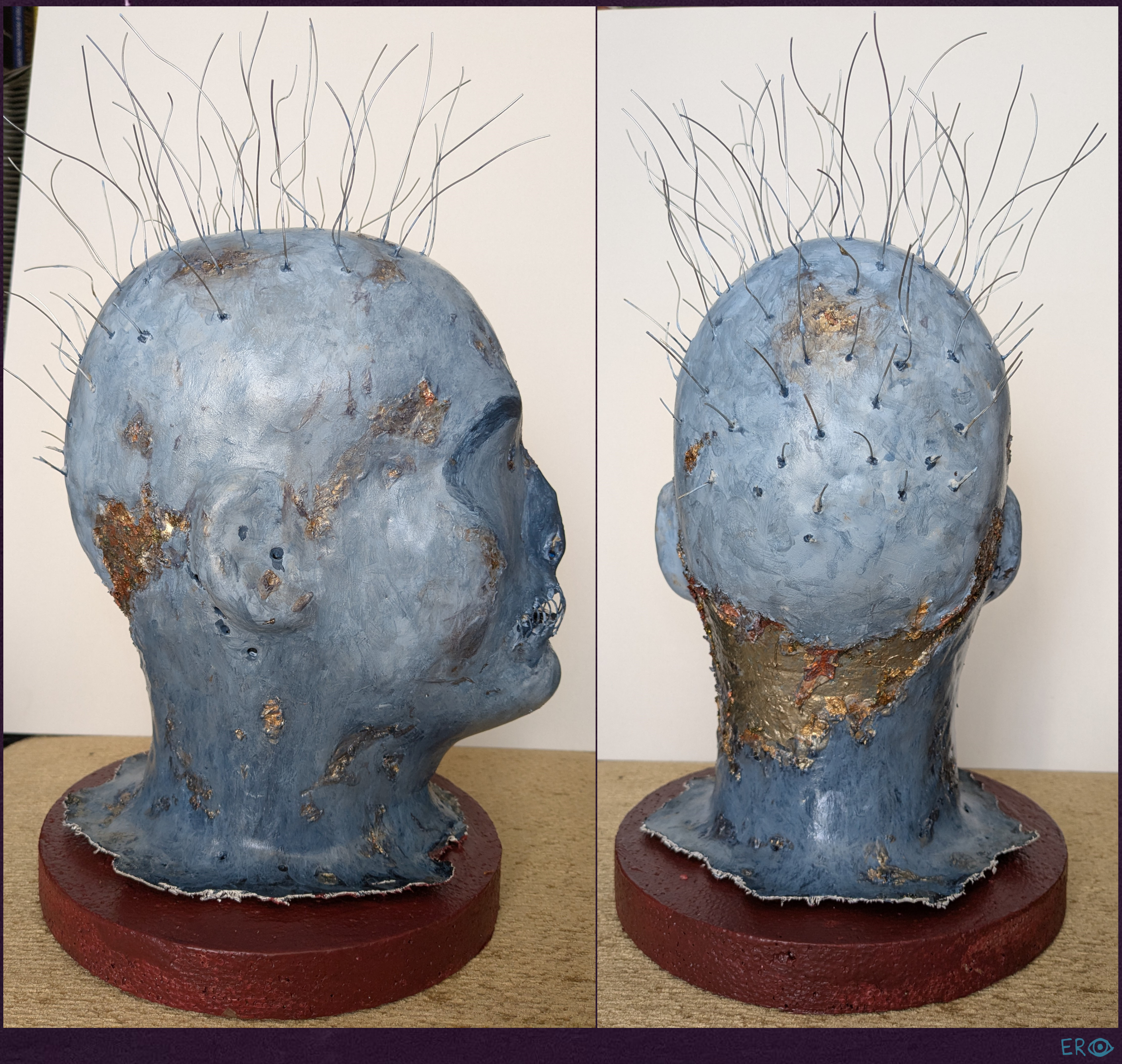 The Metal is Cold - Elias Rosenshaw 1/29/2025 - Foam head with foam clay, acrylic paint, decoupage glue, metallic flakes, gel pen, wire, canvas, and a foam base.