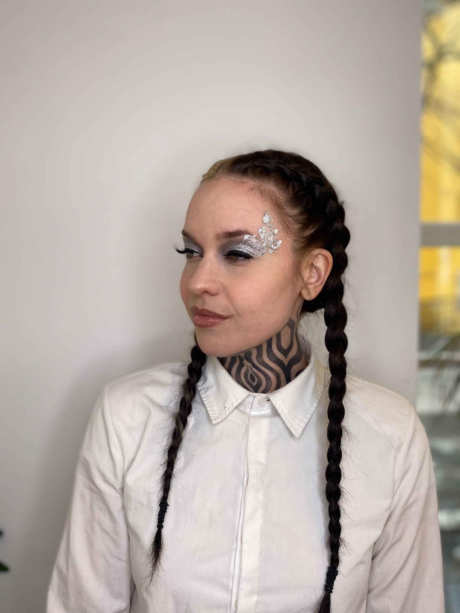 Creative makeup with silver flakes