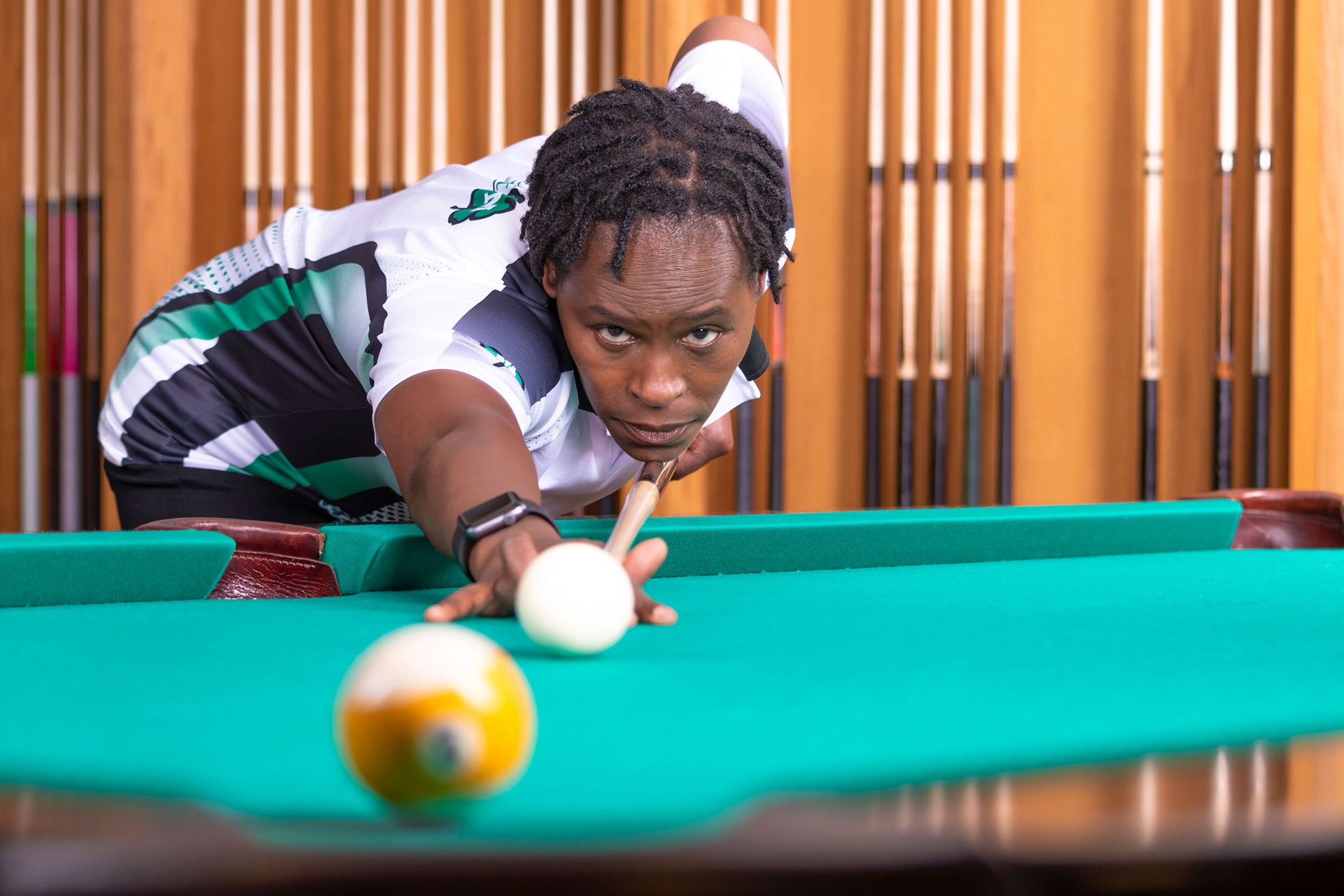 Sponsored player portrait with pool table