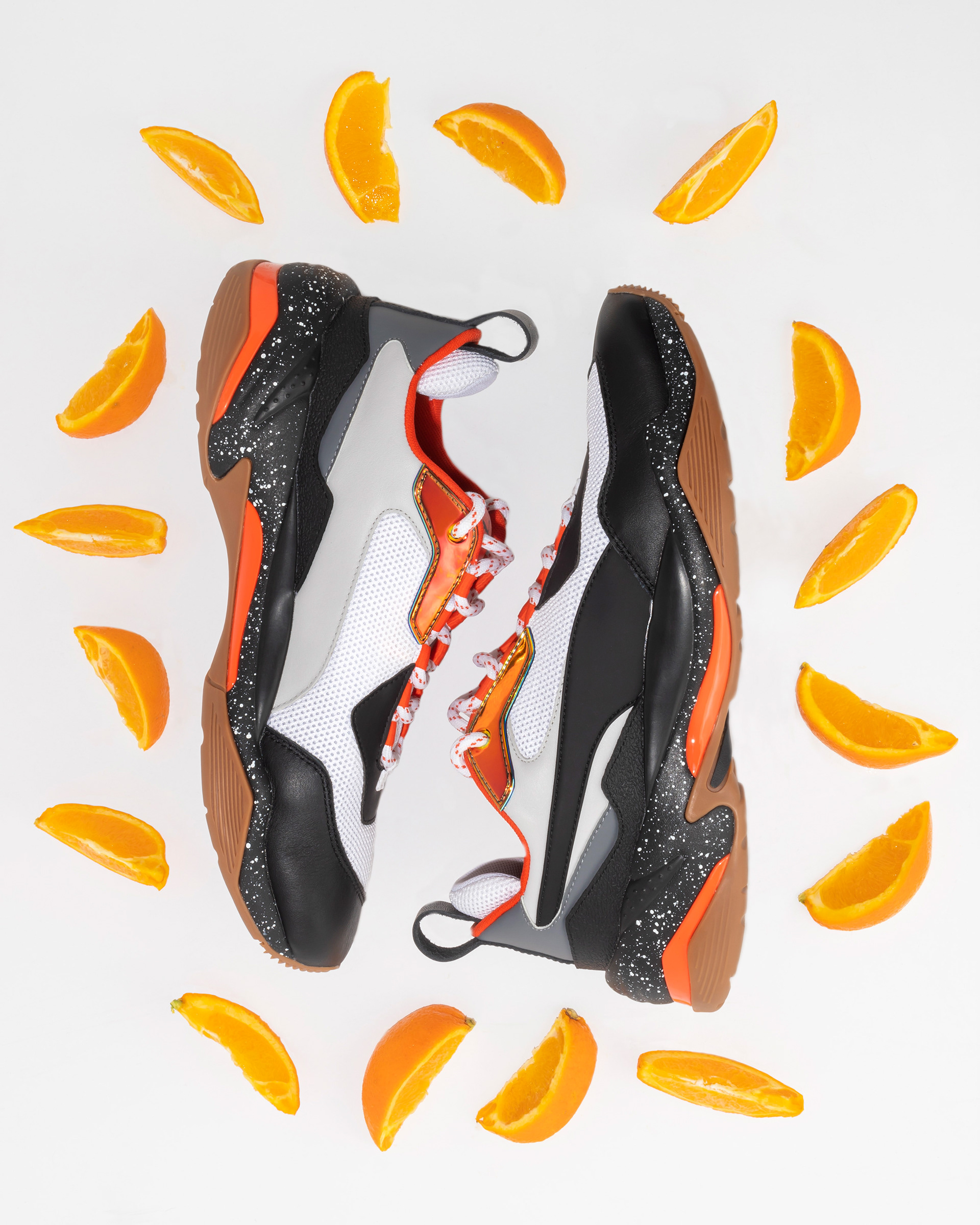 PUMA Thunder Electric's on white with oranges