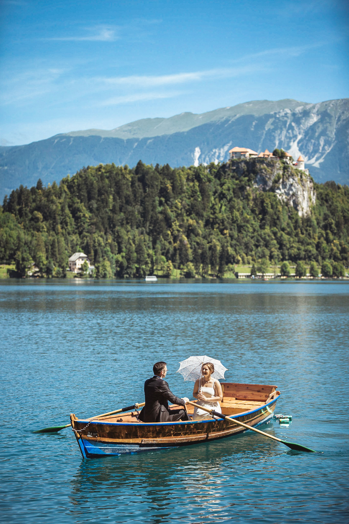 Rowing in front of Bled Castle - Wedding photography Matej Kolaković