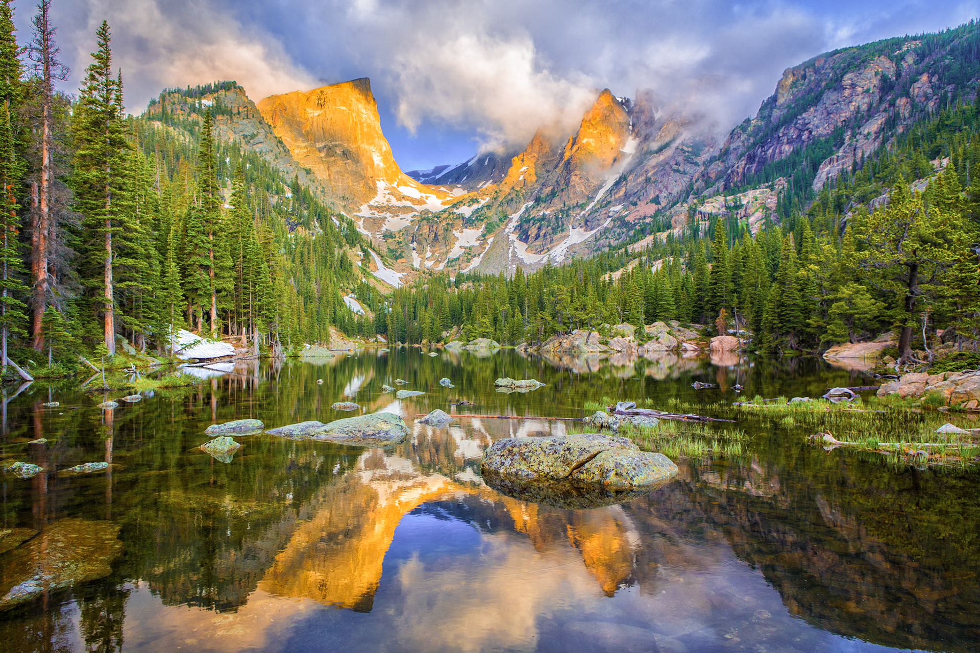 The sun breaks through the clouds at Dream Lake
