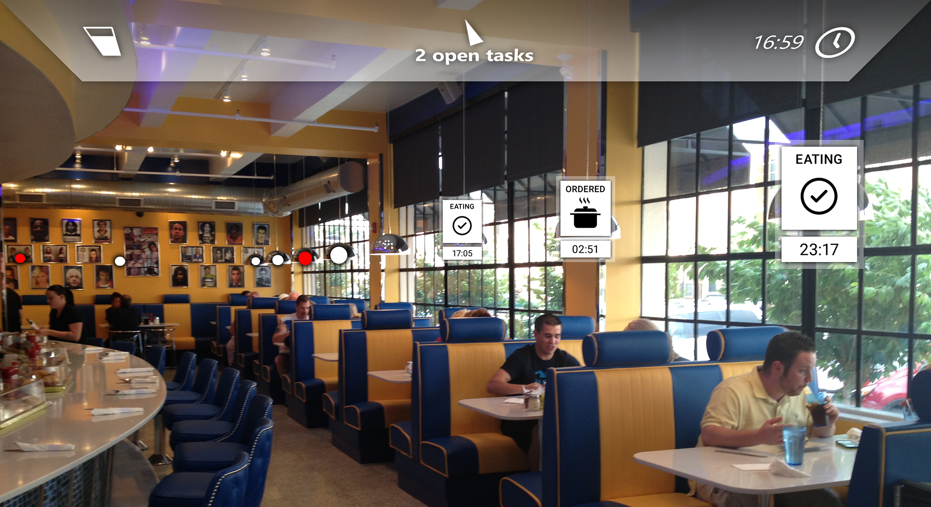 Concept art: A restaurant with floating white and red dots over each table. Nearby tables have detailed information about the state of the table, e.g. "Eating". A head-up-display on top shows the waiter what table to serve next.