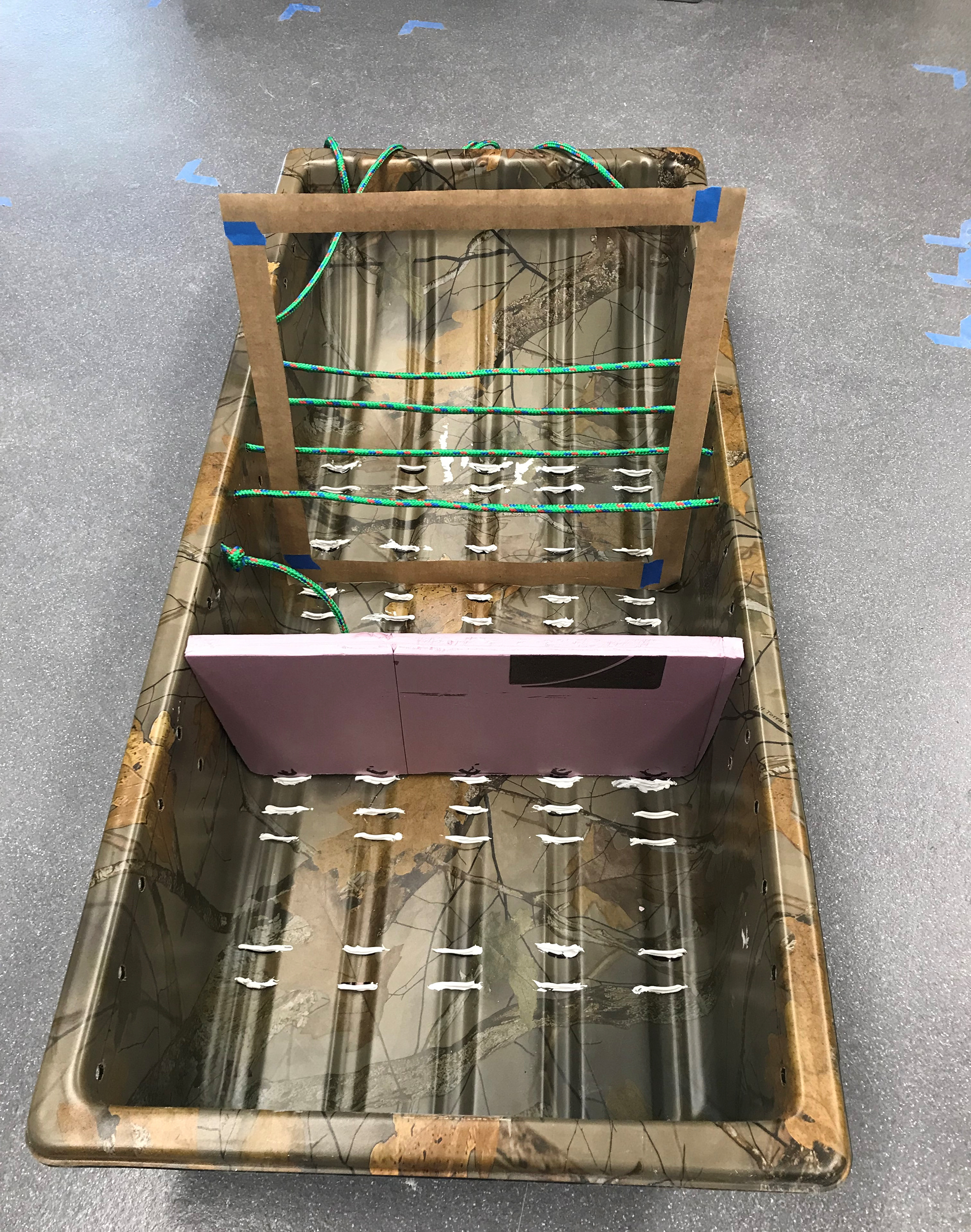 Sled with divider and ropes