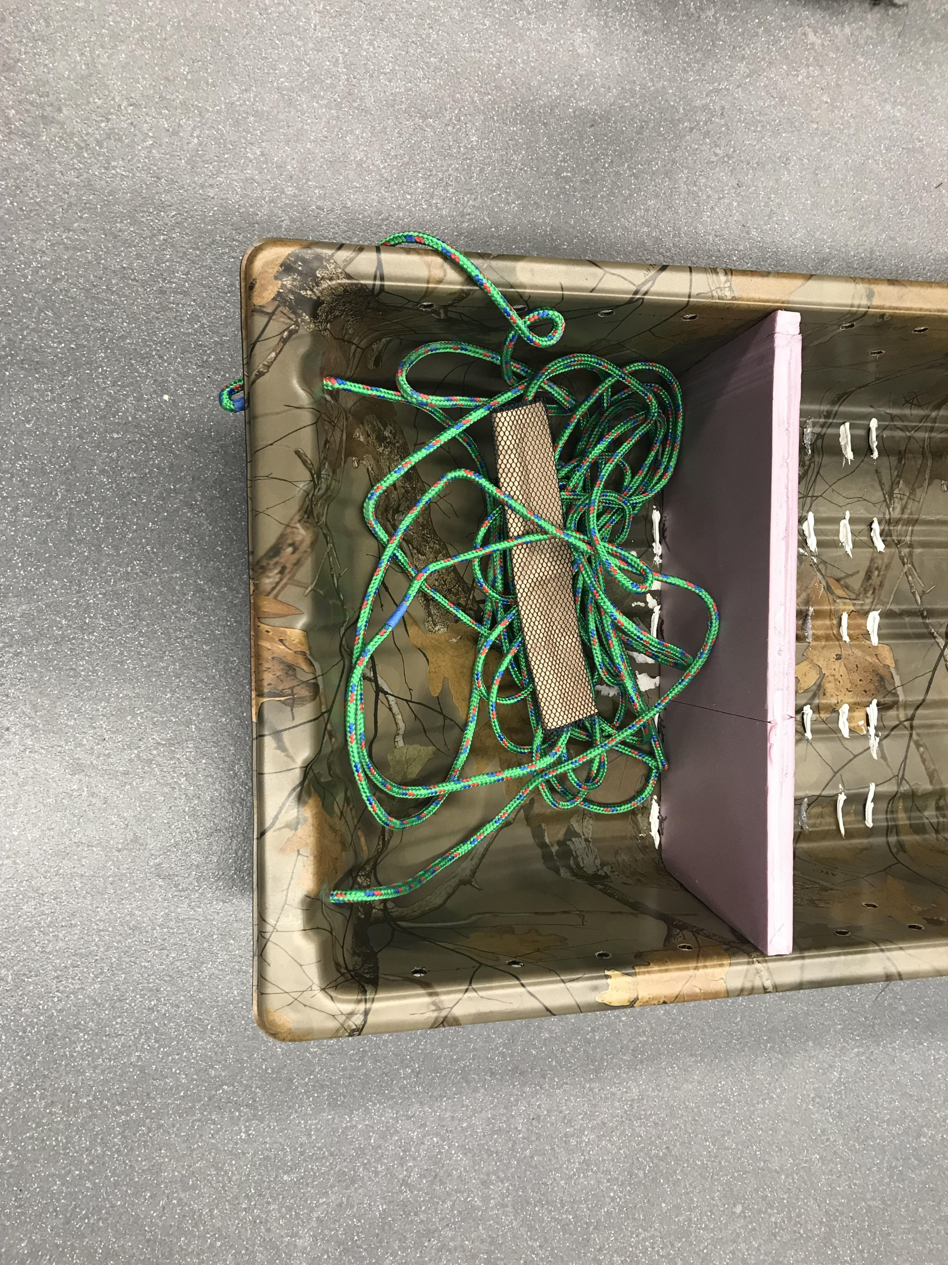 Sled with rope stored