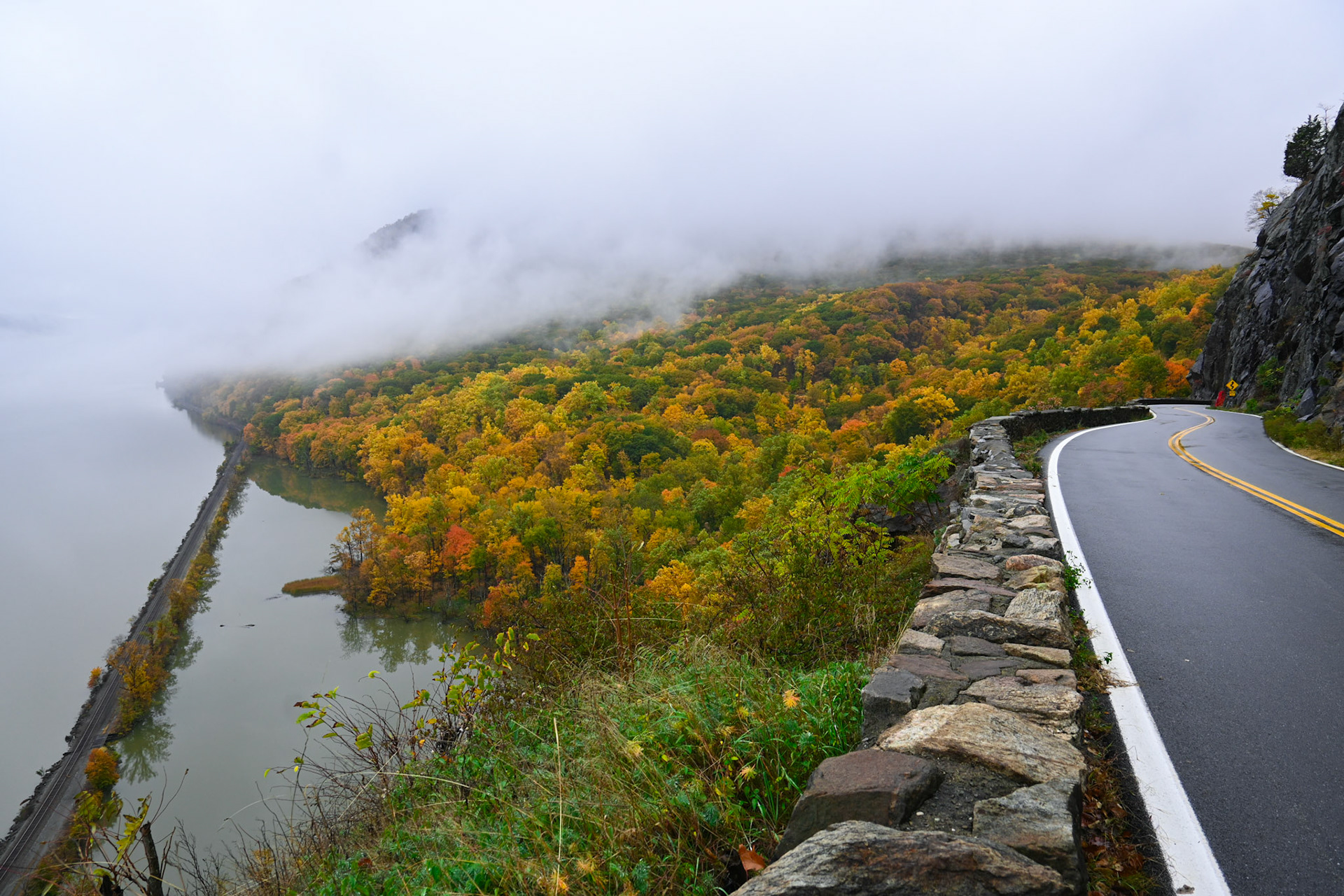 A view down to the west bank of the Hudson River, on the edge of Storm King Highway in the Fall