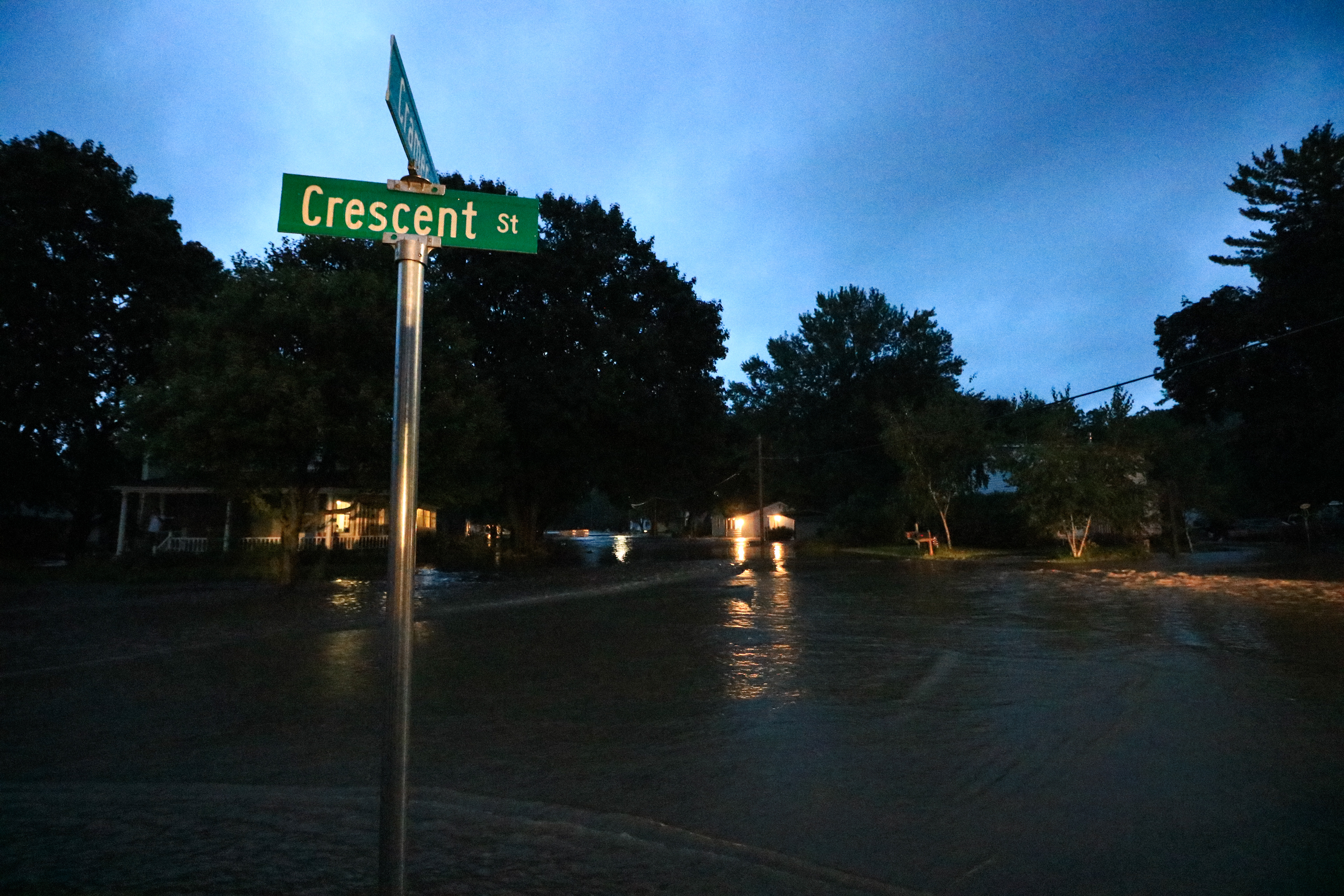 Water slowly rises at the corner of Crescent and Cramer Street in the early morning hours of August 21, 2018.