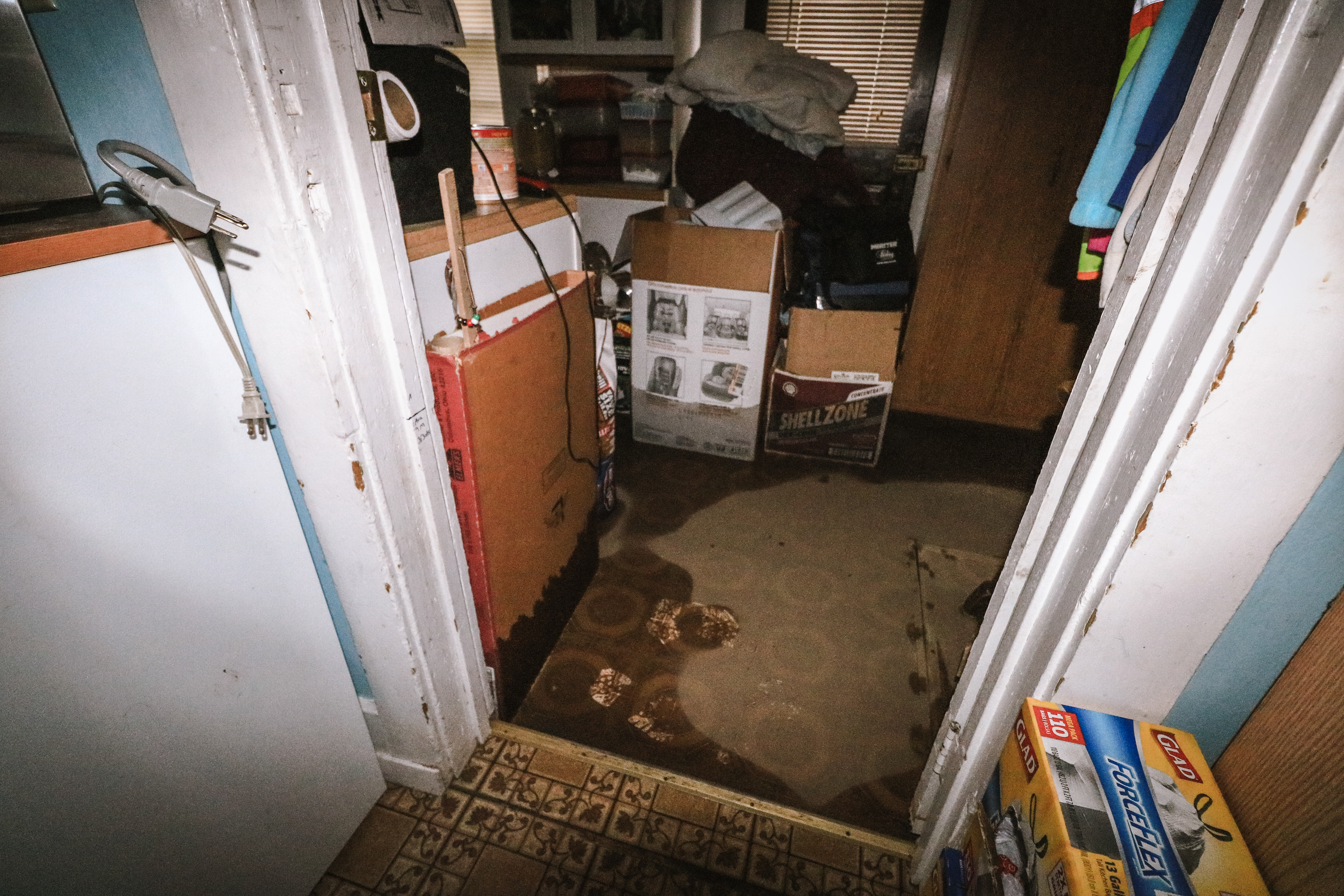 Floors in a room of the Travis home are soaked and soft.