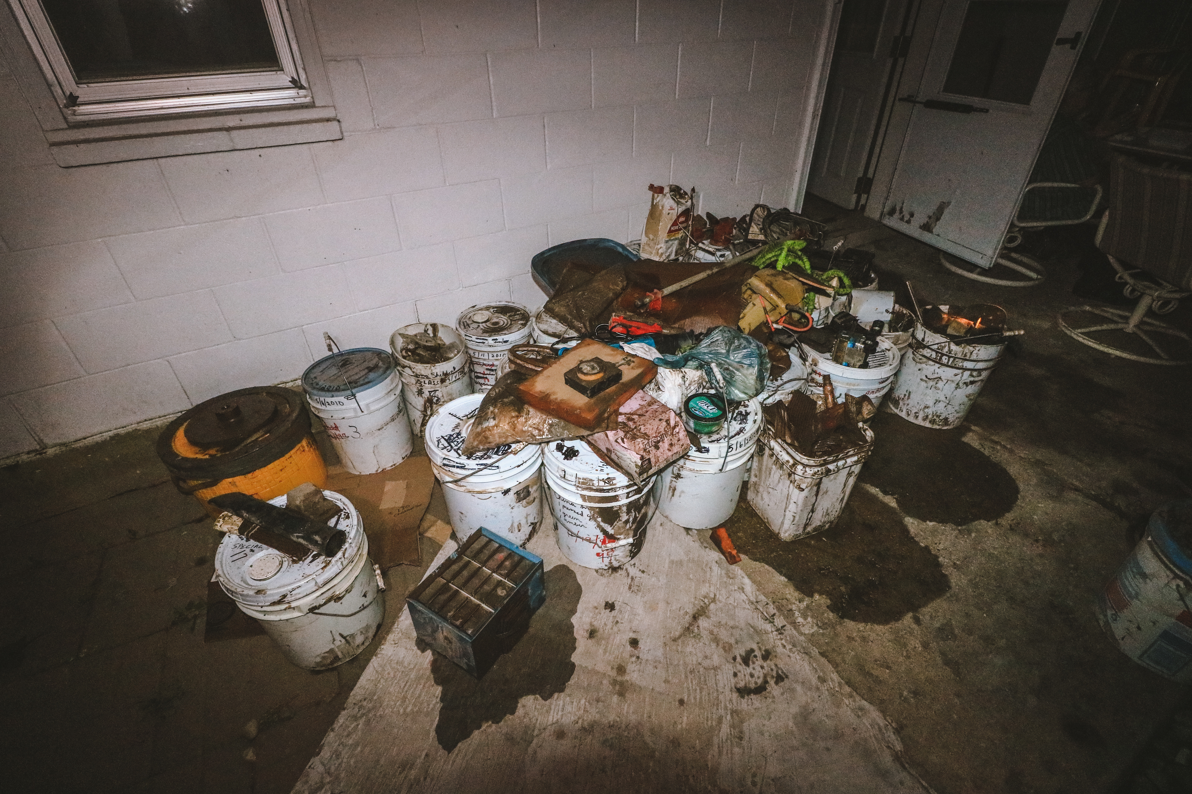 Belongings of Bob and Fran Dublins are soaked and full of mud from floodwaters.