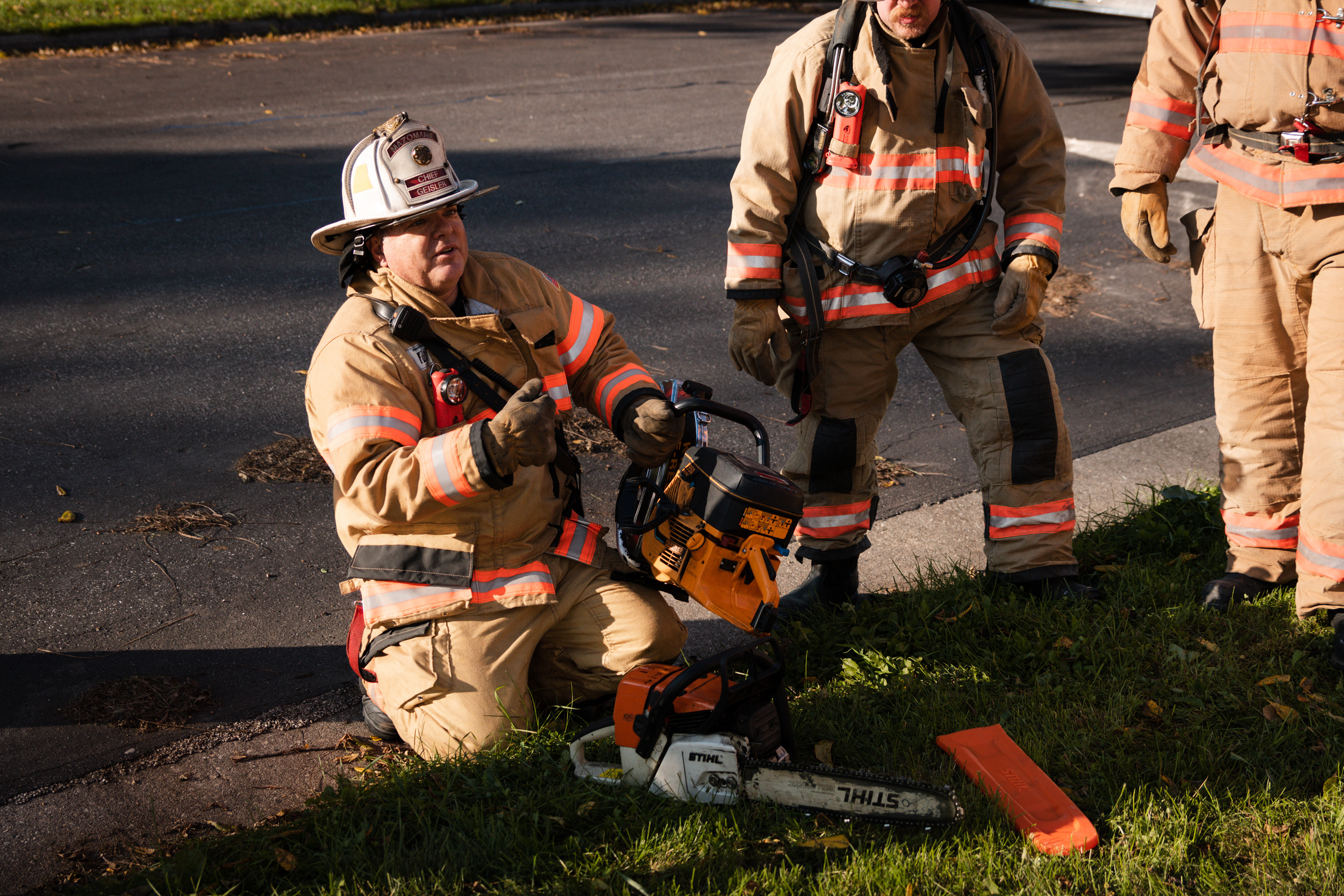 Mazomanie Fire Chief, Mark Geisler, teaches firefighters safe and proper equipment usage during a practice house fire.