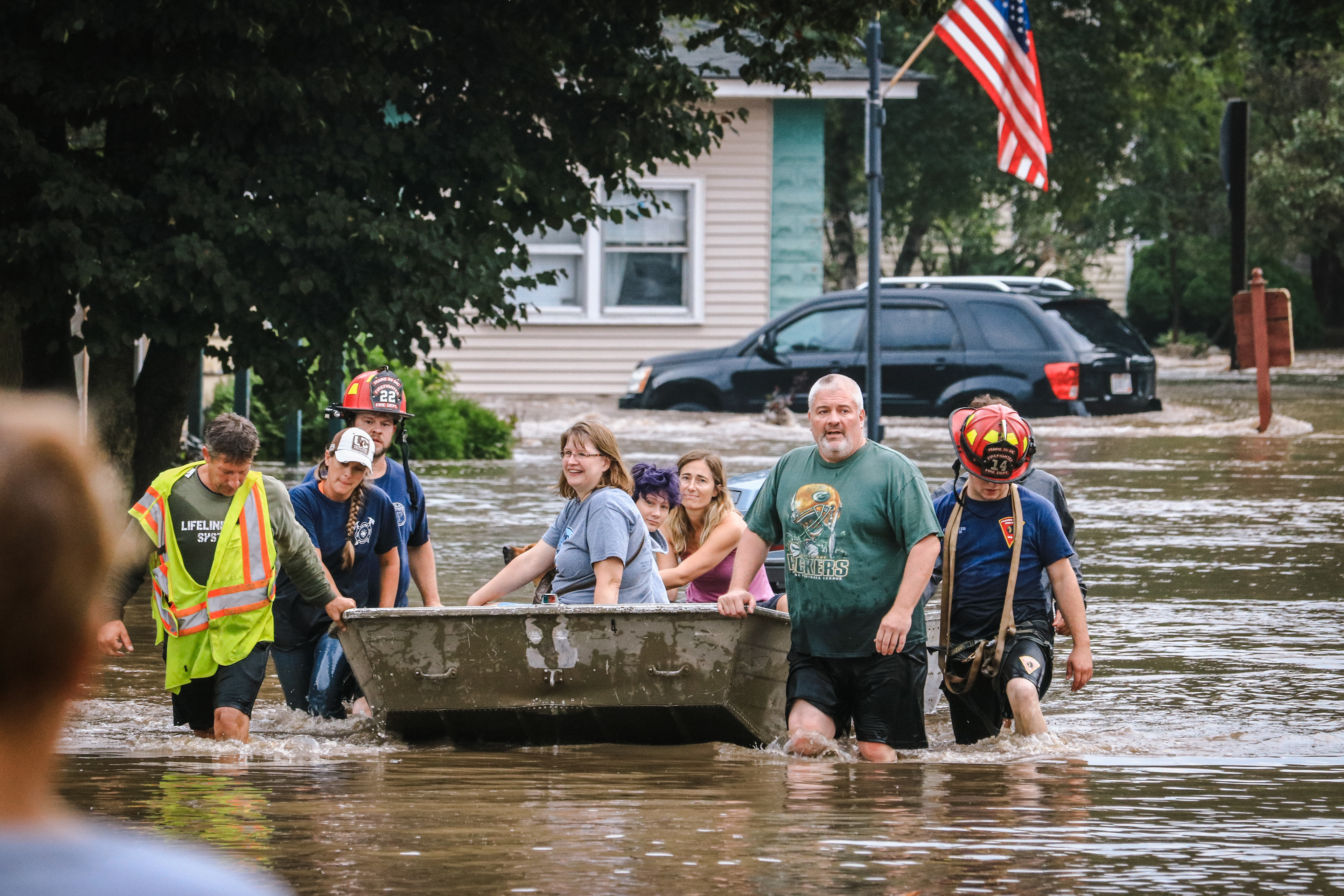 Part of the Foreseth and Holmes family is rescued from their home on Hudson Street.