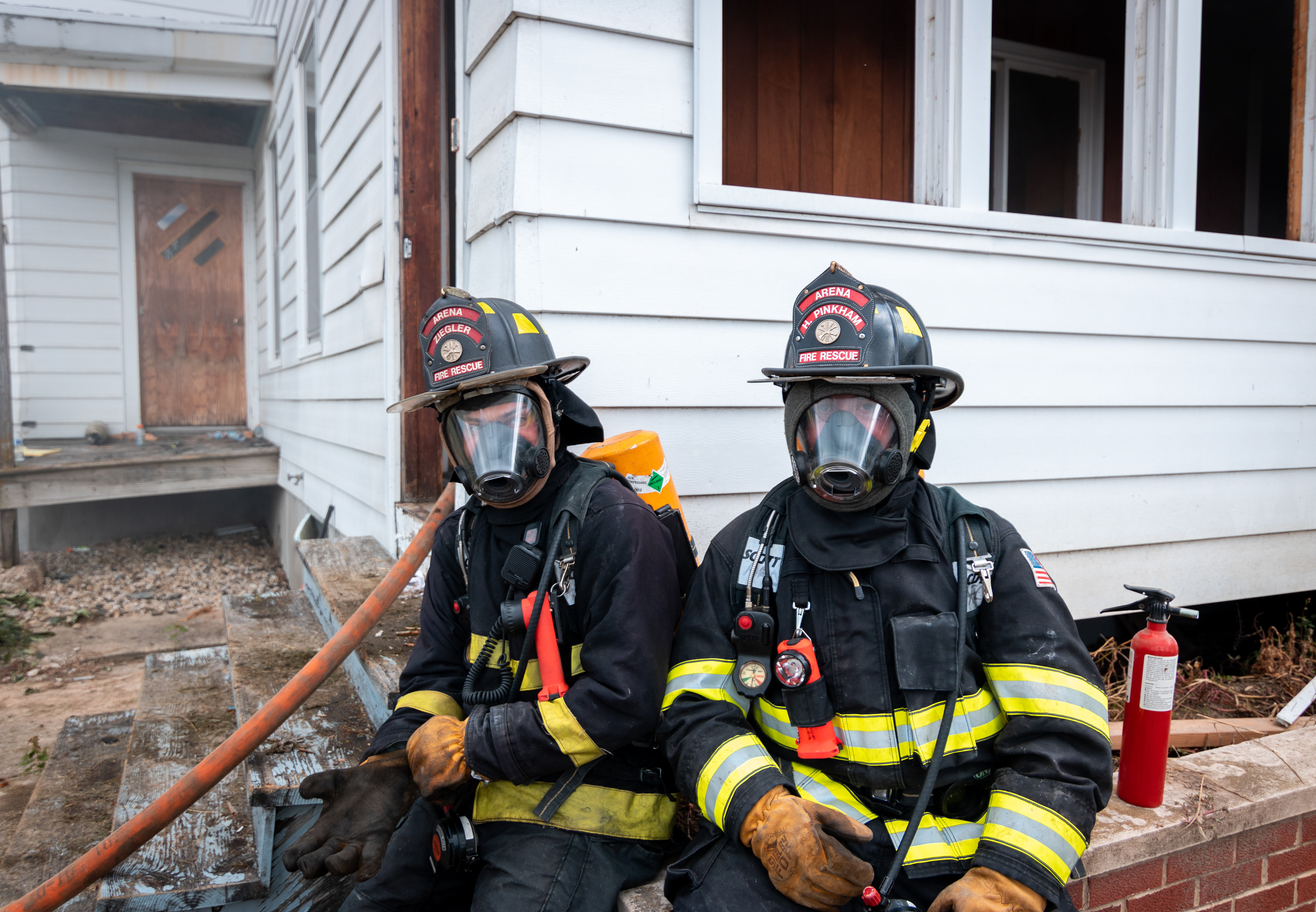 (L to R) Tucker Ziegler and Hunter Pinkham represent Arena Fire Department at the controlled house burn.