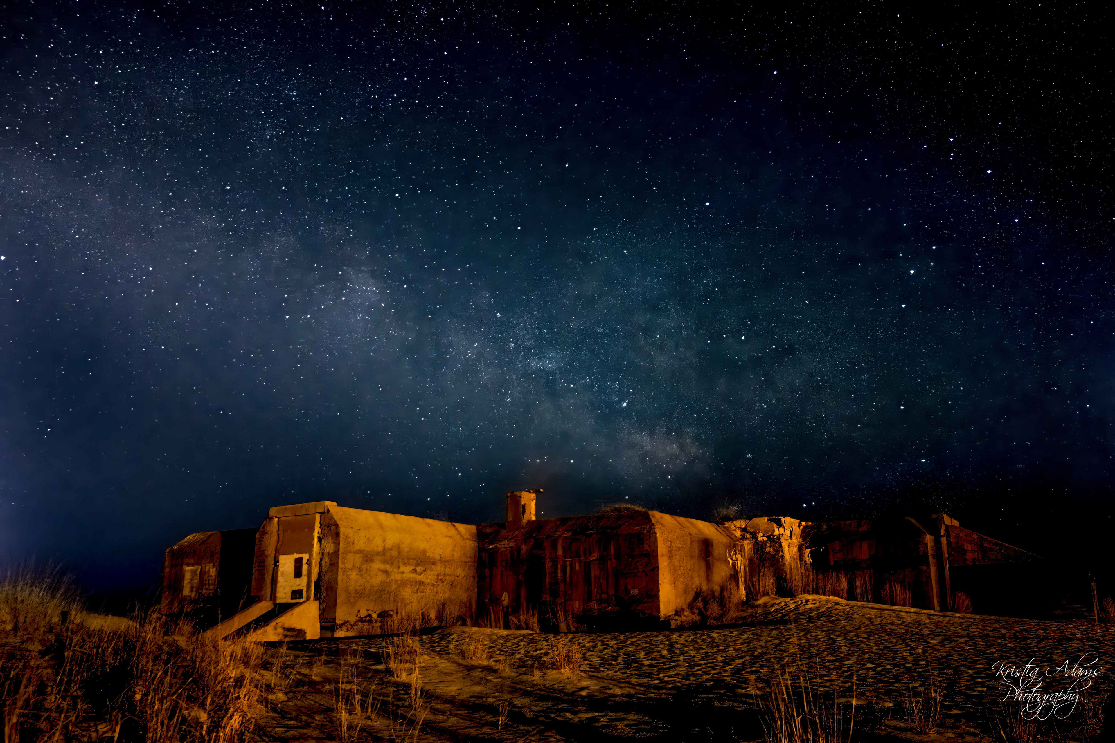 A bright starry night shows the Milky Way core rising above the World War II era bunker in Cape May, New Jersey.