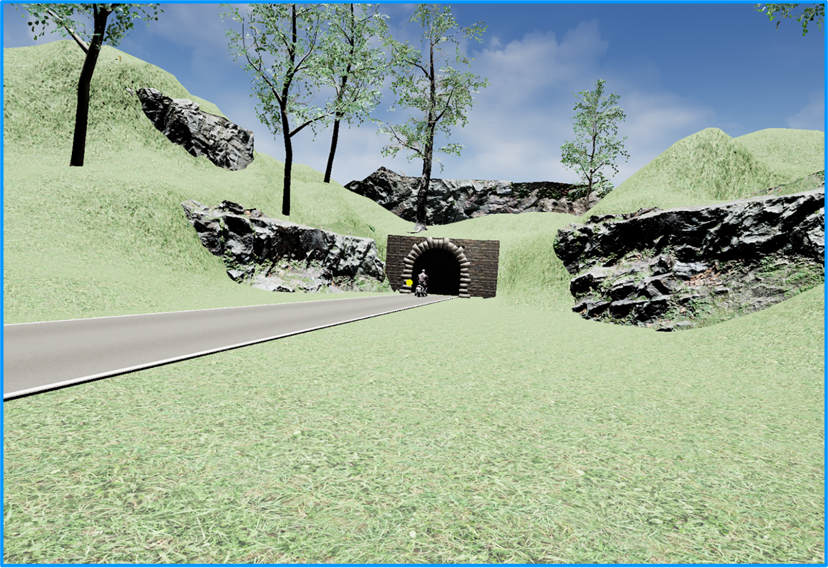 Rider exits road through the tunnel on the right