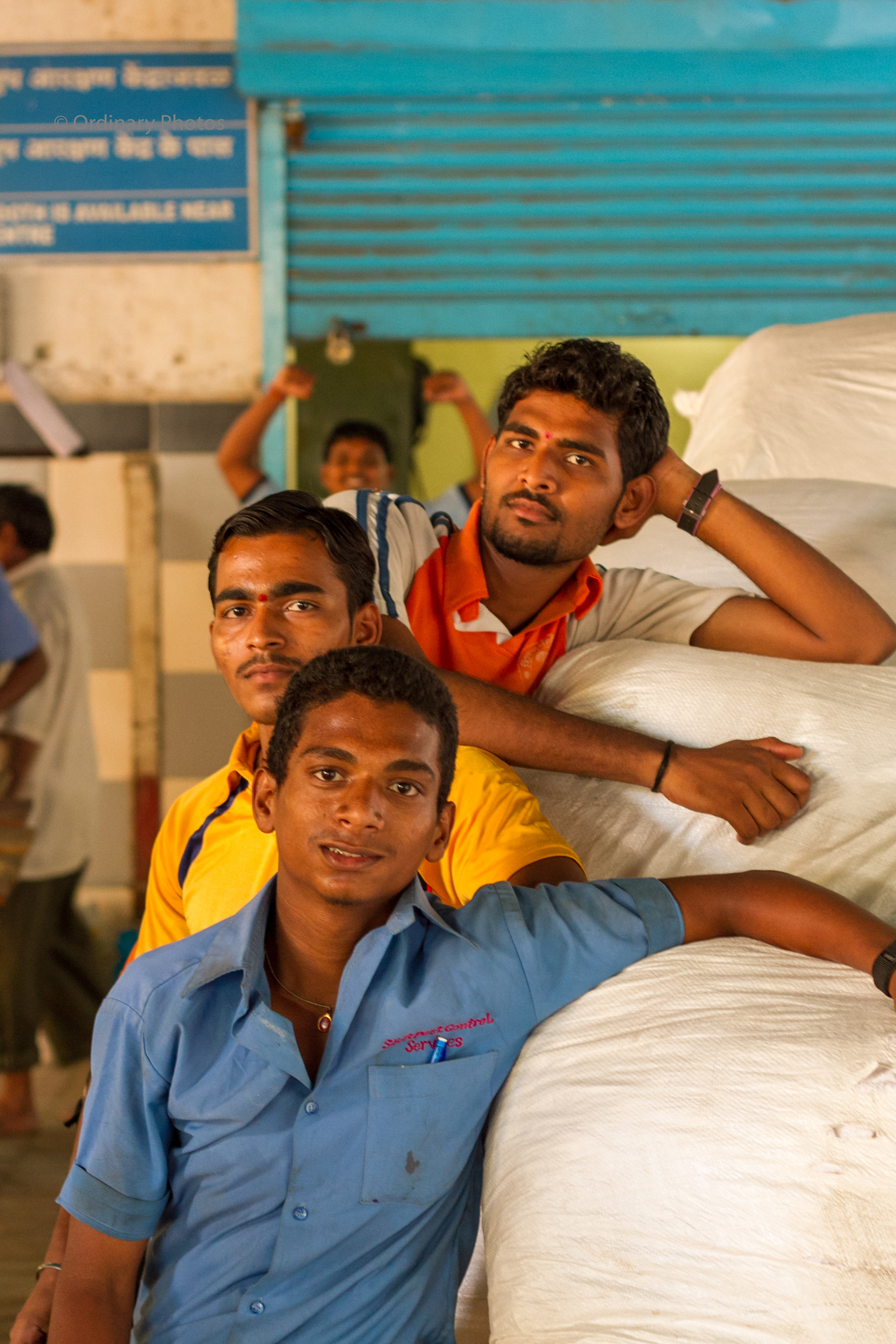 Young guys carrying cargo at CST railway station in Mumbai
