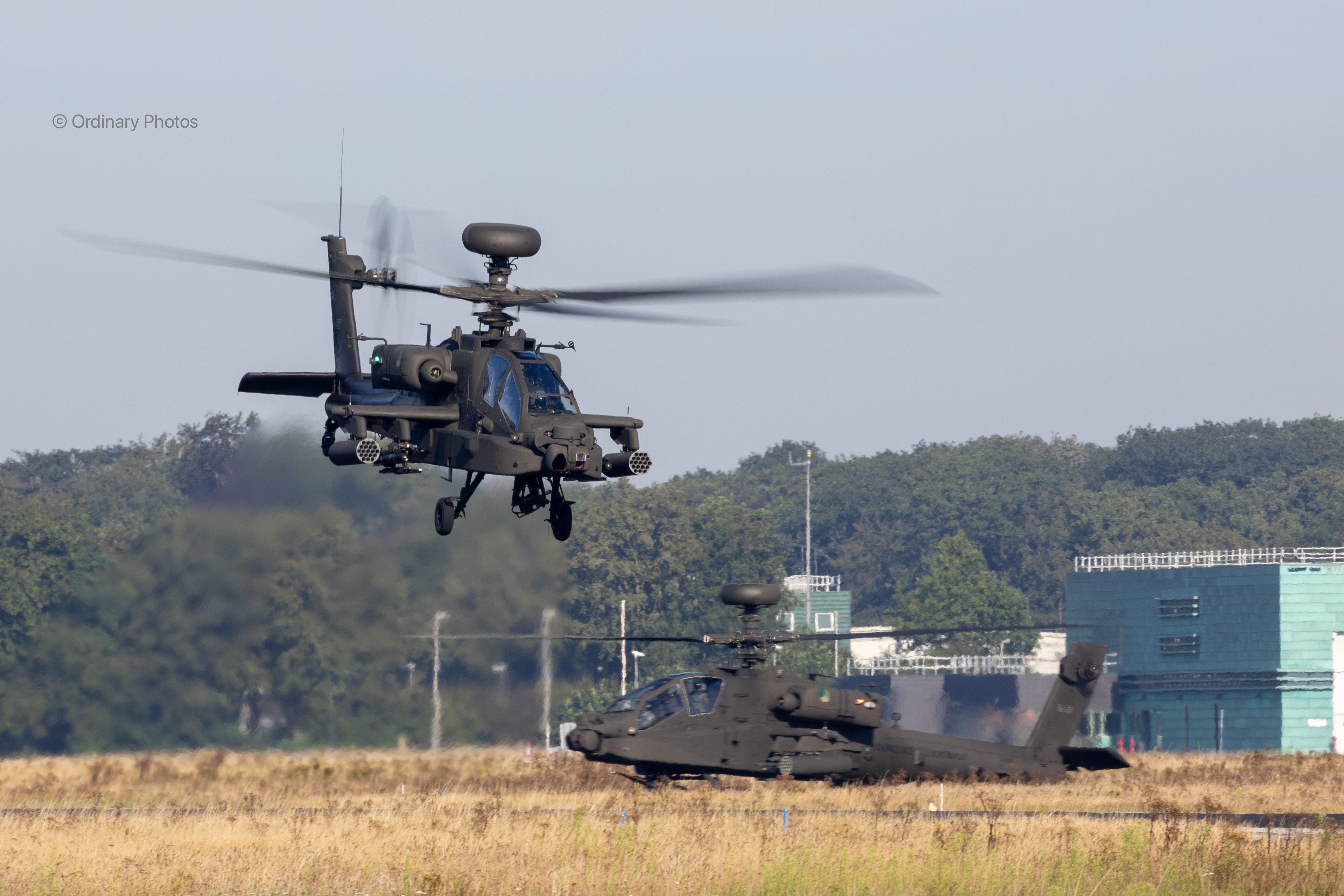 Two AH-64Es from the RNLAF taking off at Gilze-Rijen air base