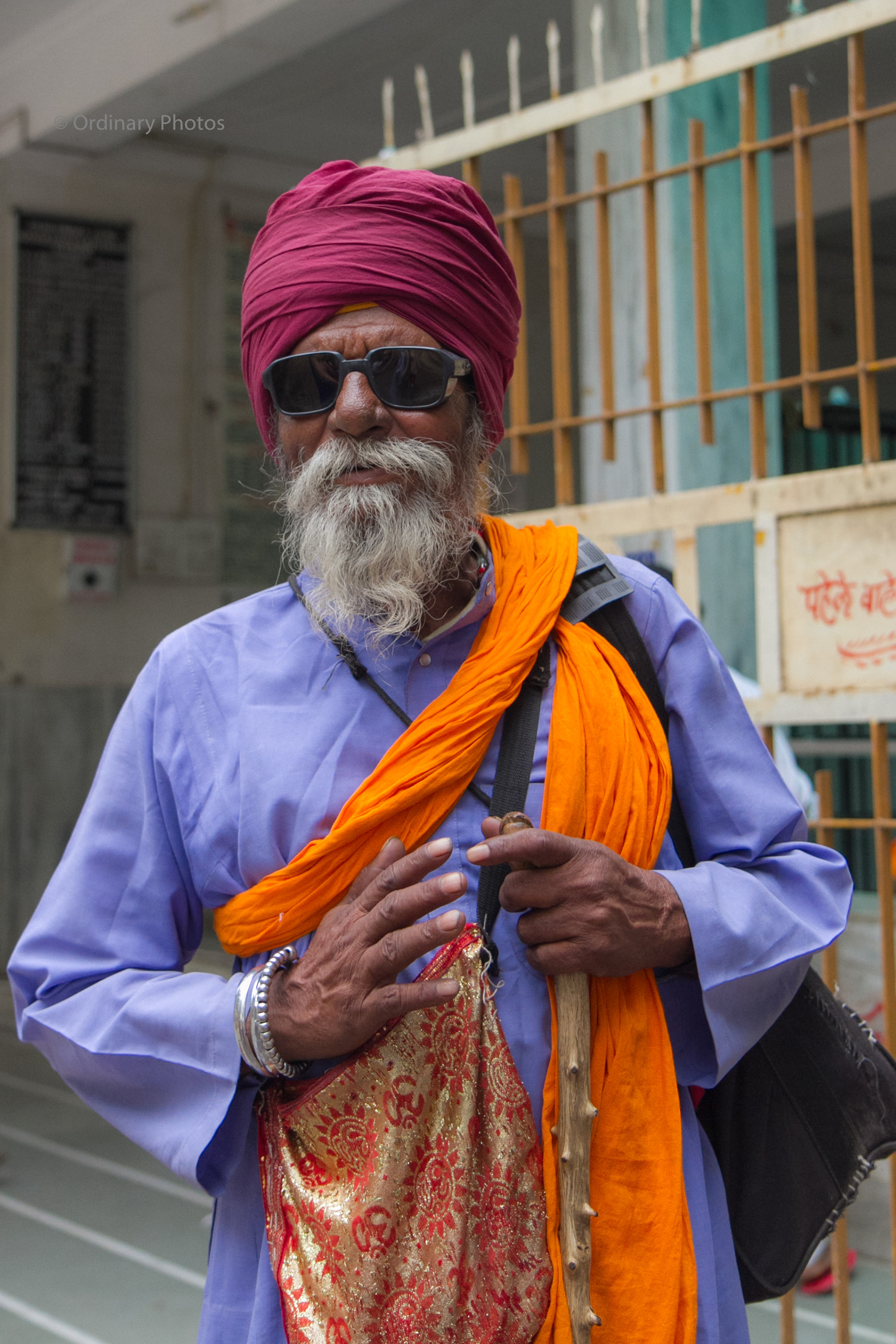 A man in sunglasses at a Sikh temple in Nashik, India