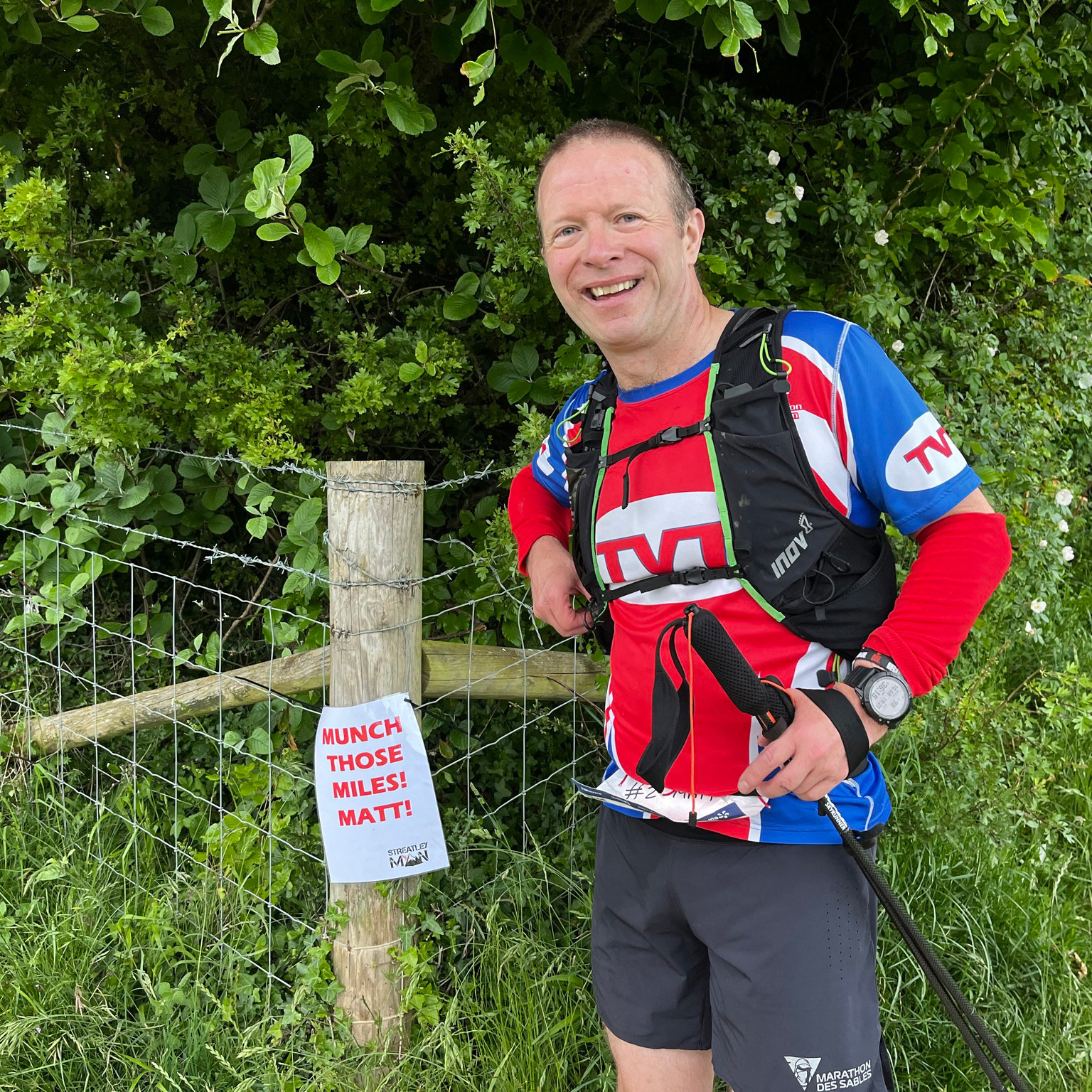 Mat posing proudly by his personalised sign