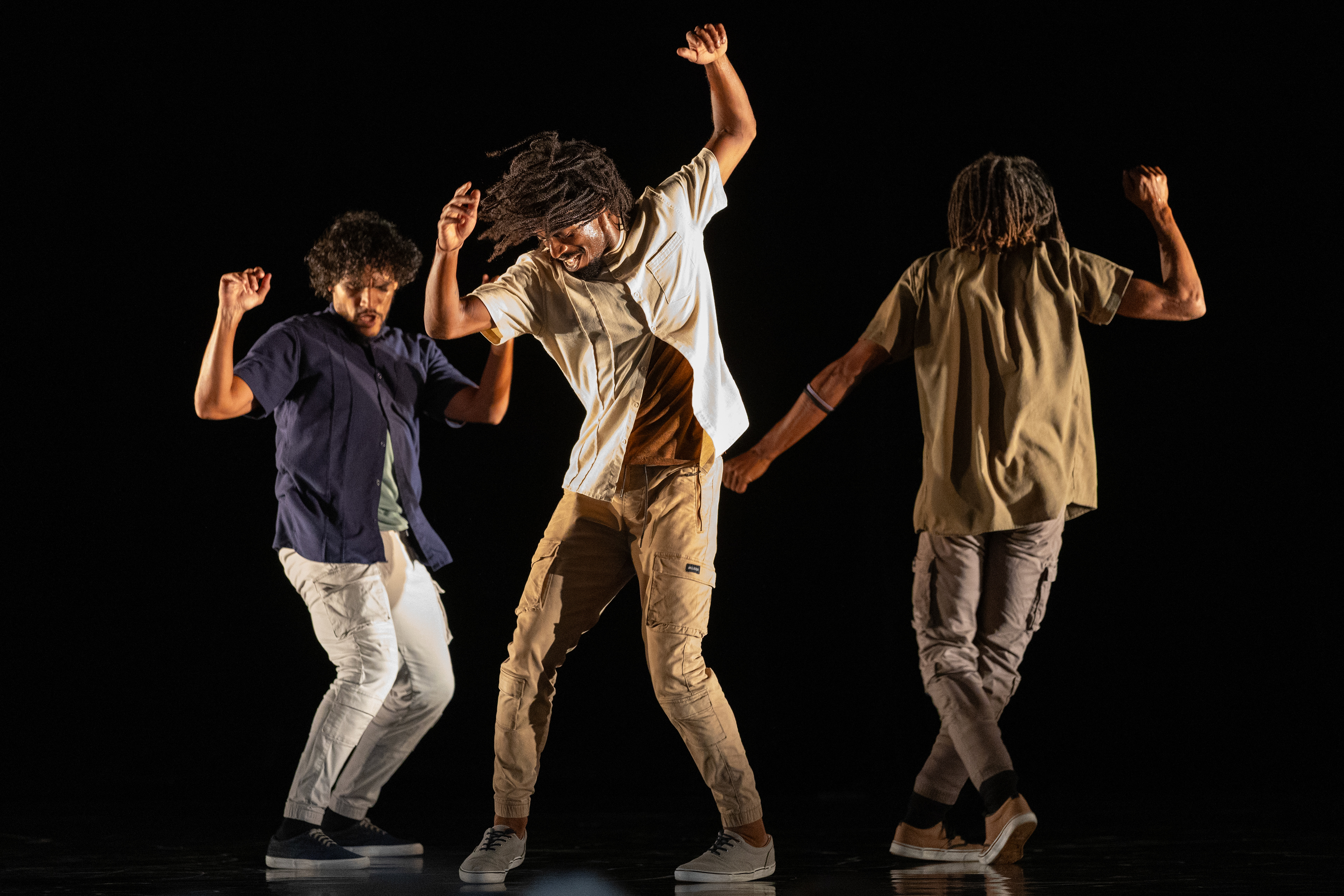 Esteban Aguilar, left, Esven Conrado Gonzáles Morales, middle, and Onsel Delgado of the Malpaso Dance Company perform the piece ”Floor… y Ando” choreographed by Ephrat Asherie on Wednesday, July 9, 2025 in the Amphitheater..